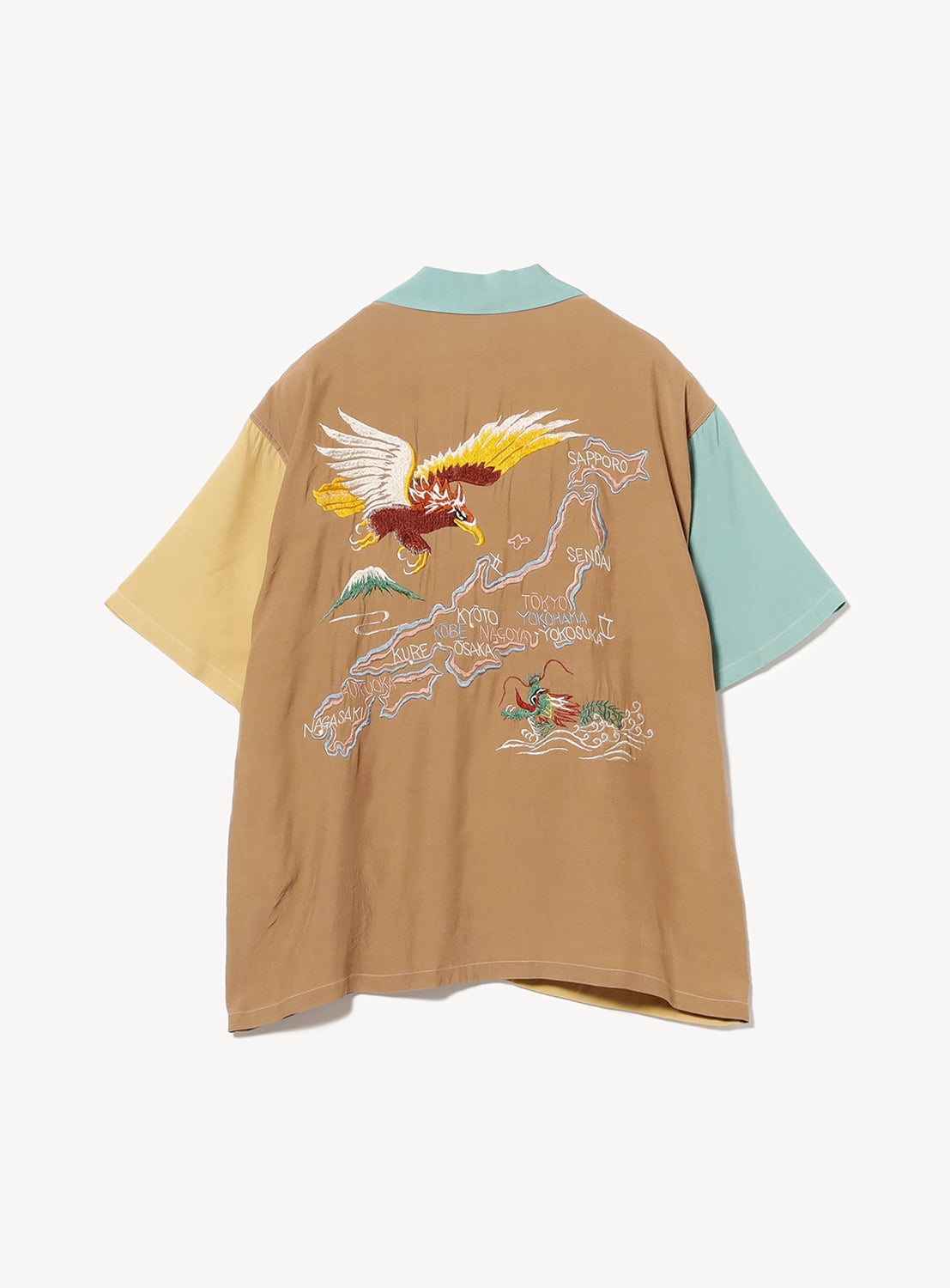 Back of teal, brown, and beige color block shirt with an eagle and a dragon facing Japan.