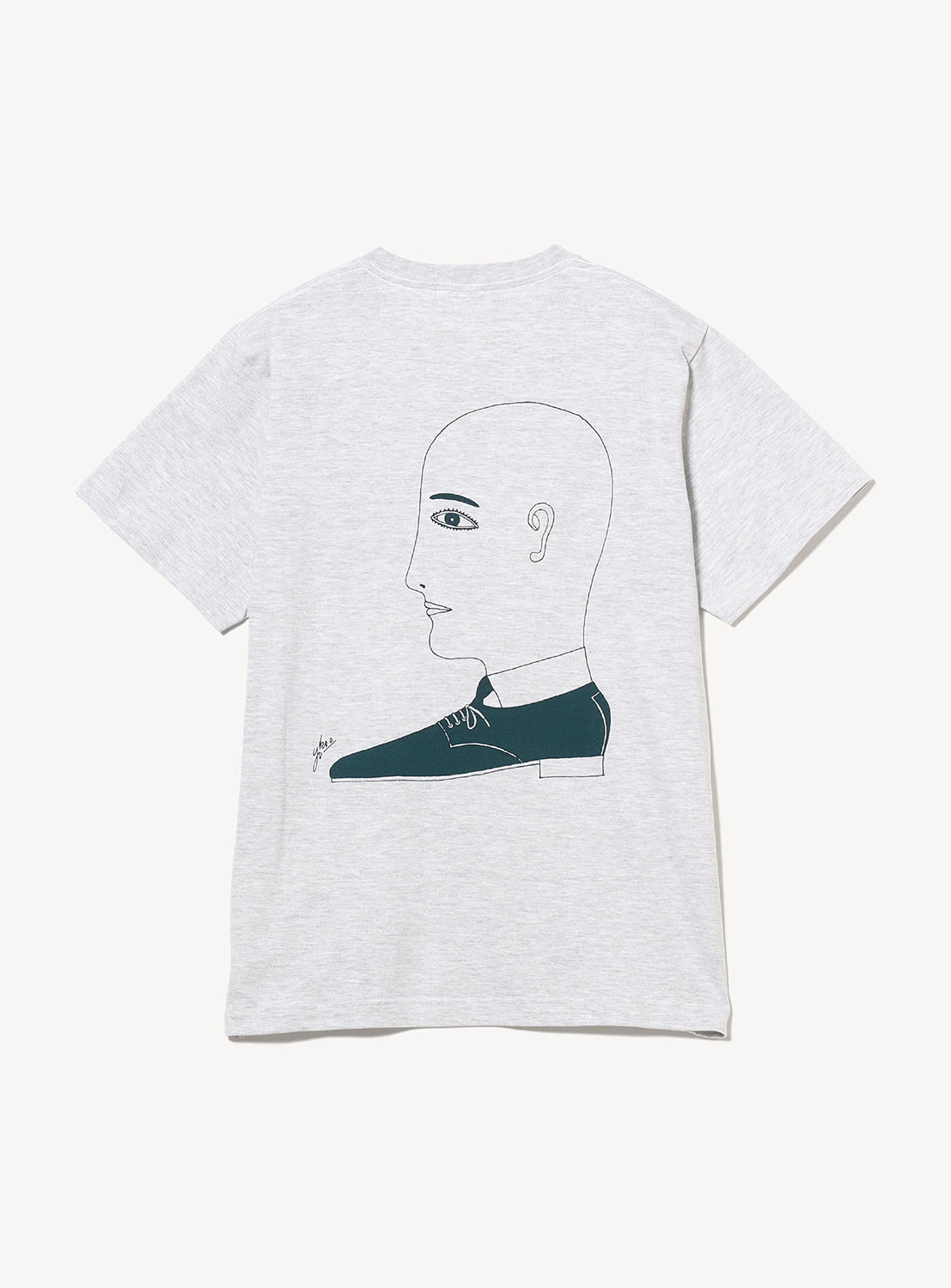 Grey t-shirt with a graphic in green of a shoe and a drawing of a side profile.