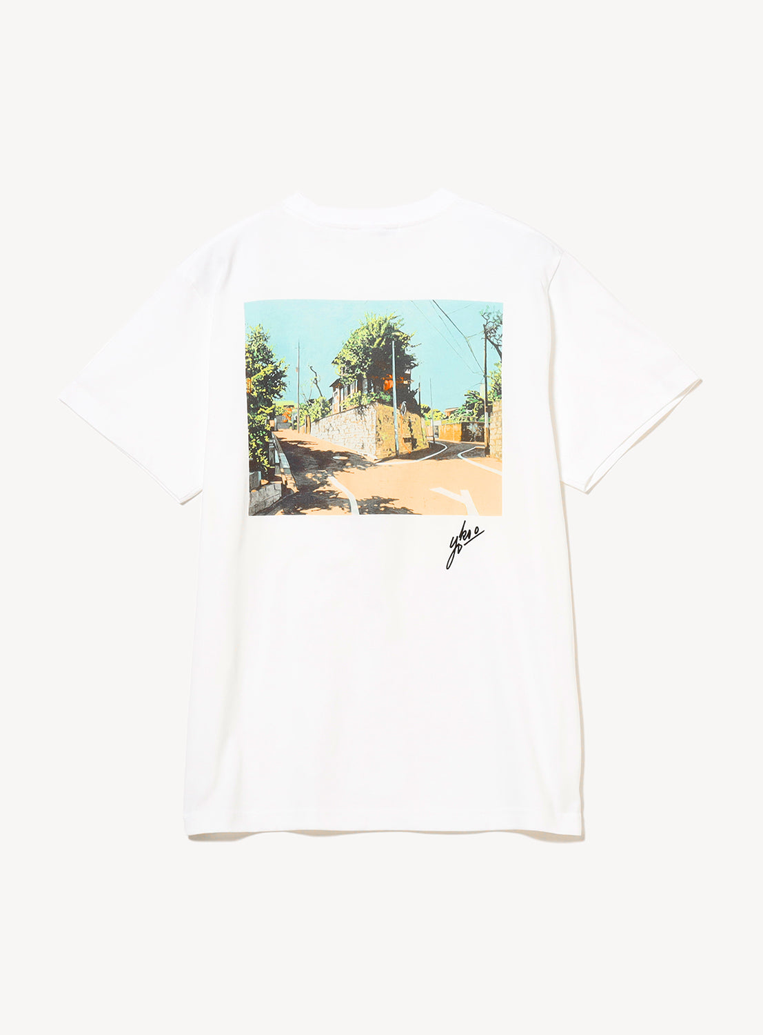 Back of t-shirt featuring a graphic print with a road.