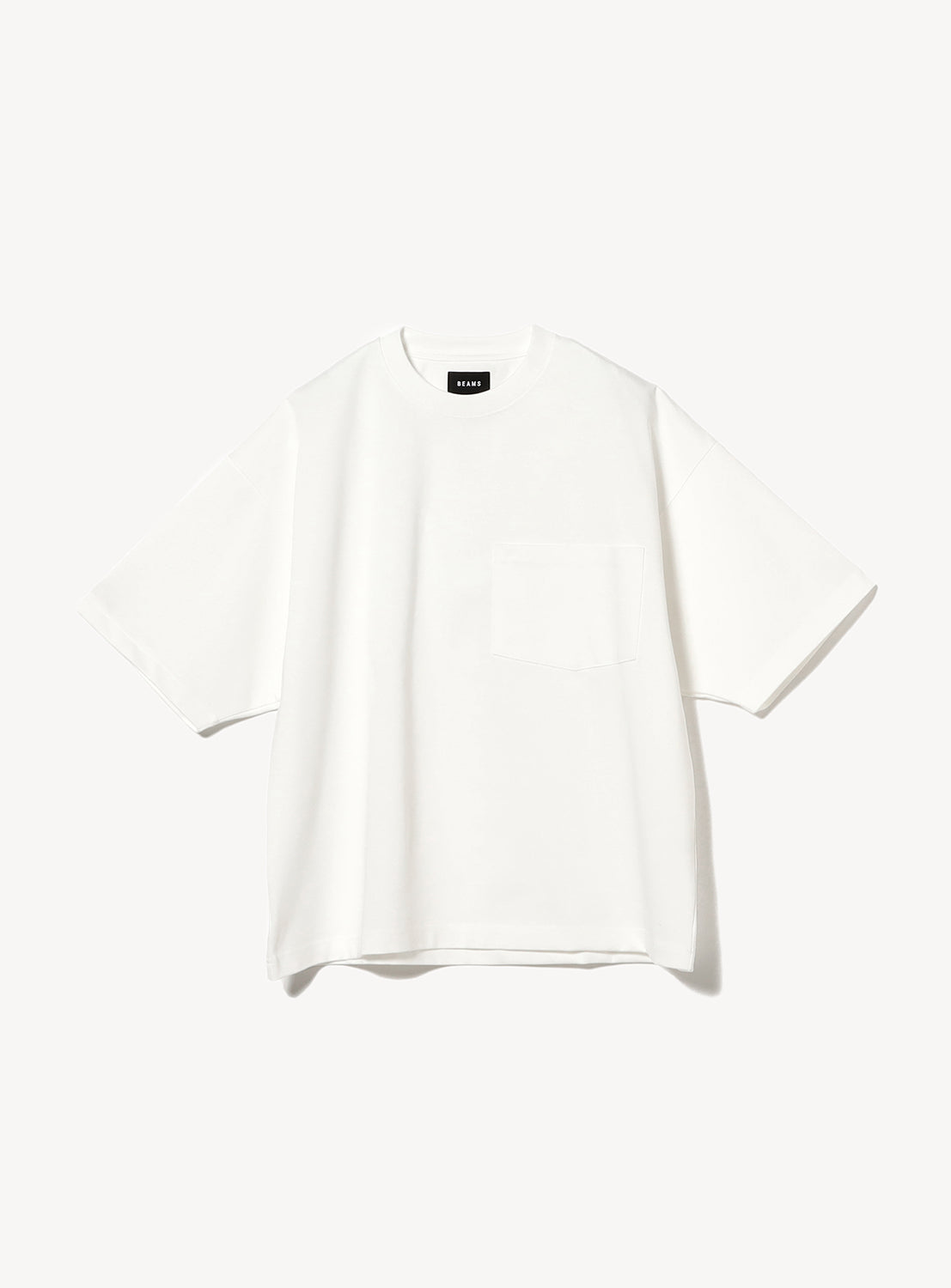 Plain white oversized short-sleeve T-shirt with a chest pocket, displayed against a white background. The shirt features a relaxed fit and a crew neckline, with a BEAMS label on the inside collar.