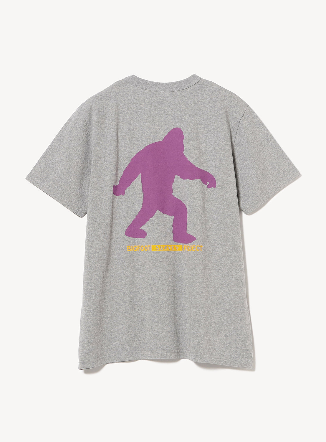 Light grey t-shirt flat lay, back view, showcasing a purple Bigfoot silhouette graphic.
