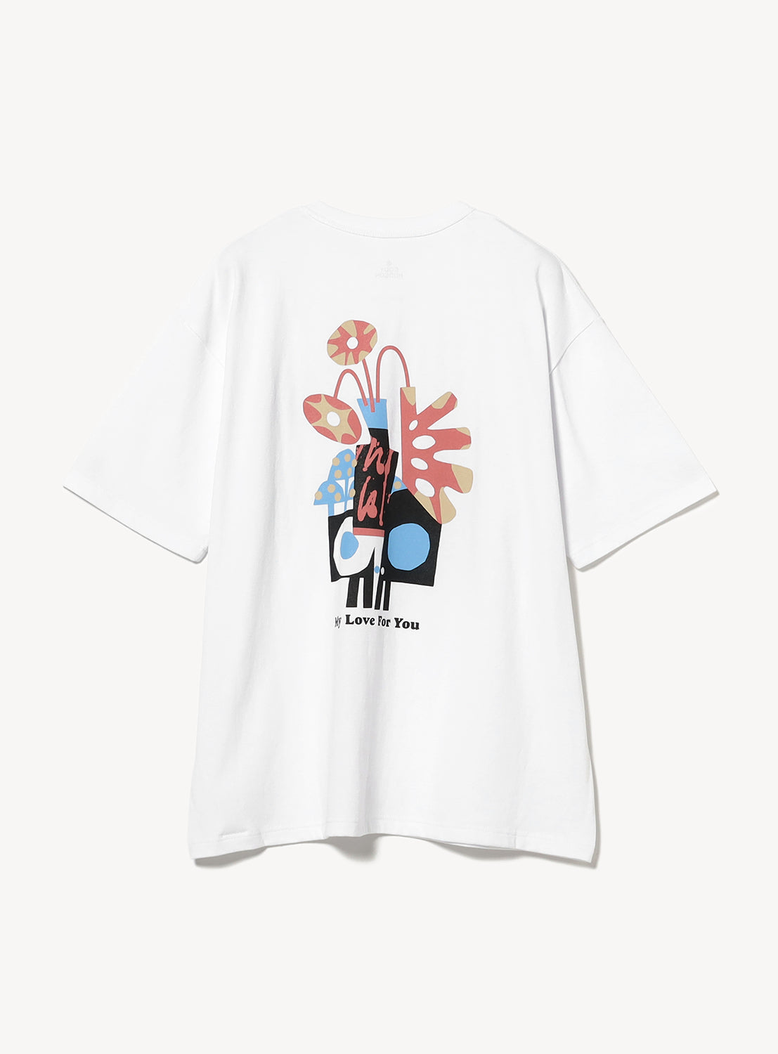 Back of a white t-shirt with a colorful graphic.