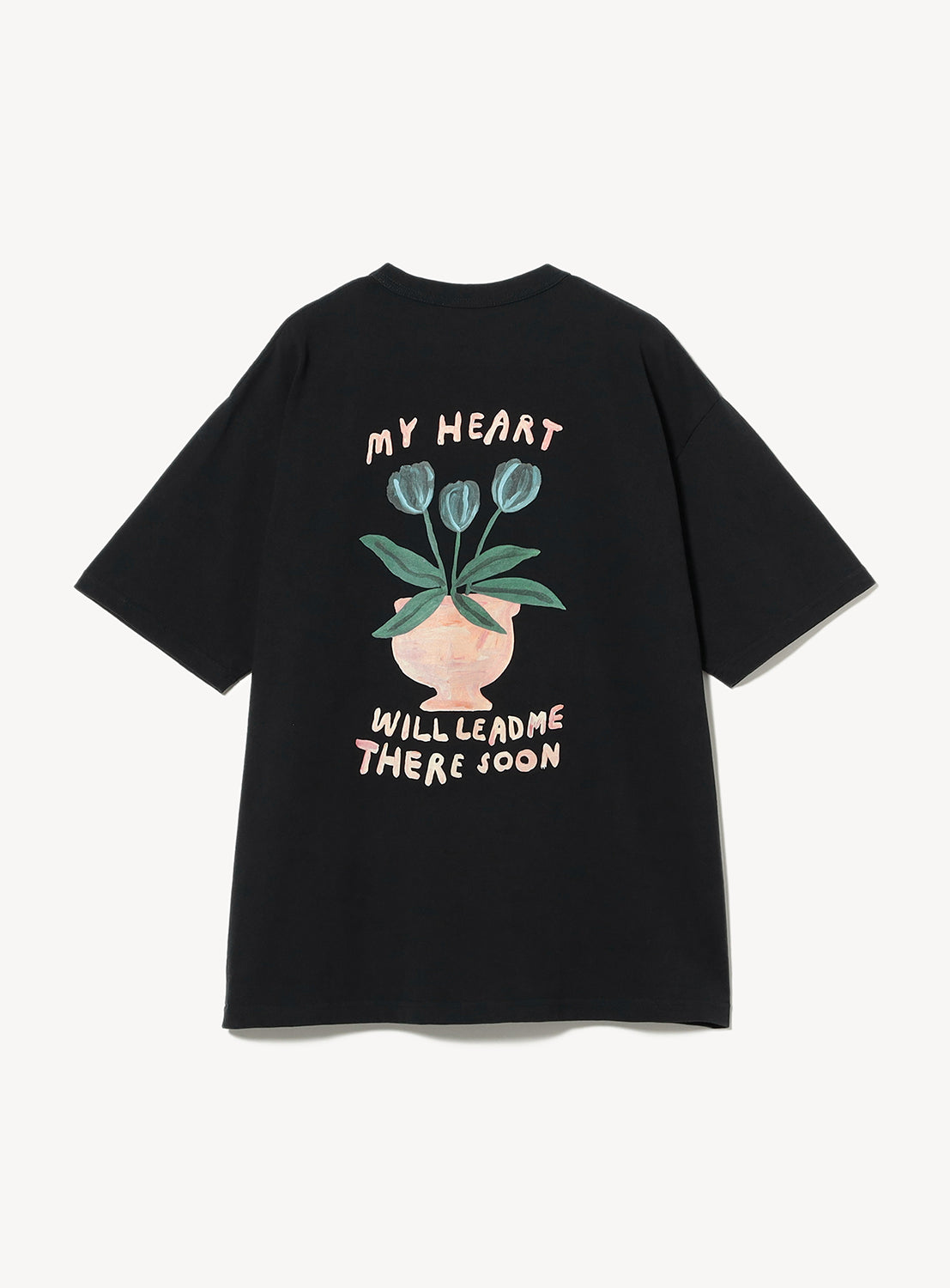 Black t-shirt with a floral design and text that says, "My heart will lead me there soon."
