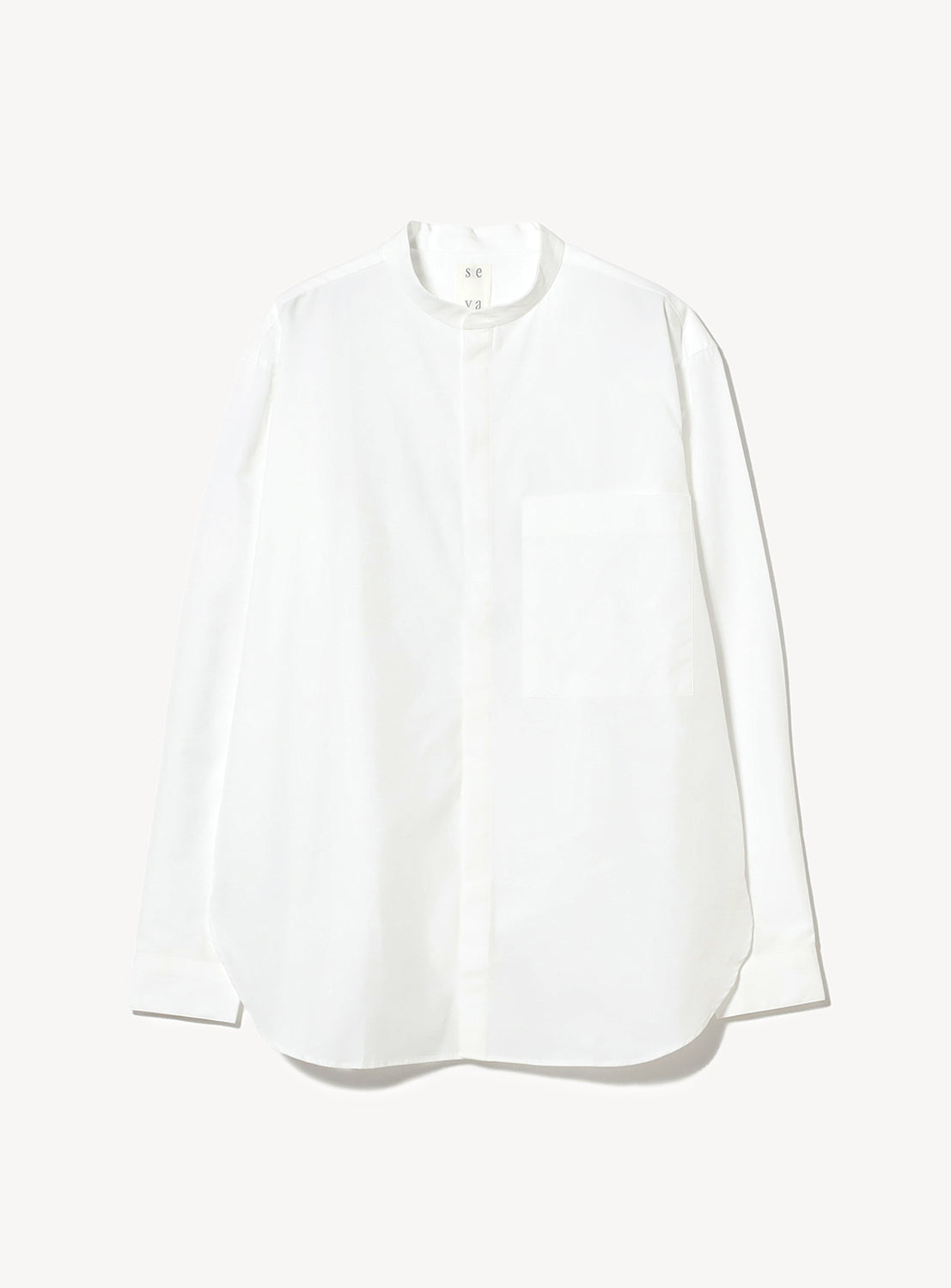 White blouse with mock neck collar and a front chest pocket.