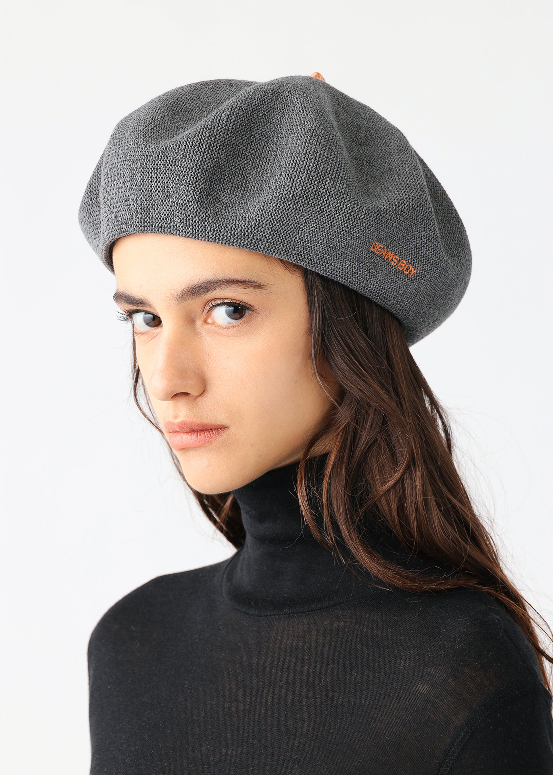 A gray Beams Boy beret with orange embroidery on the front.