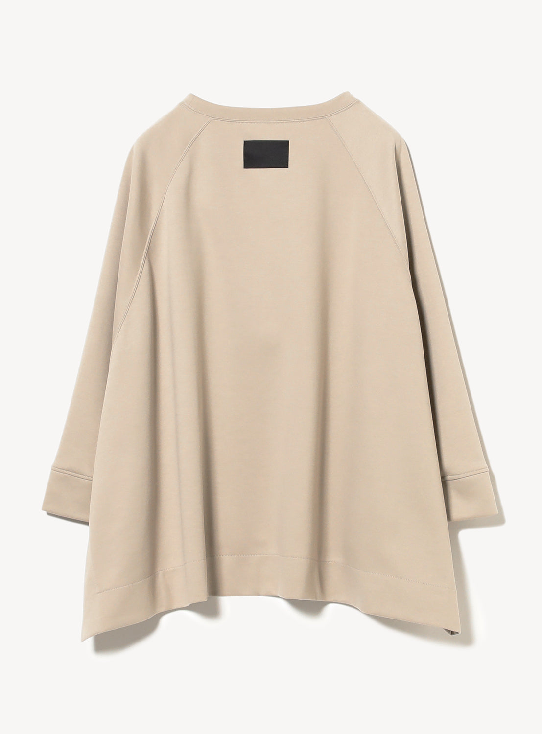 Back view of the beige sweatshirt showcasing the width of the sweatshirt.