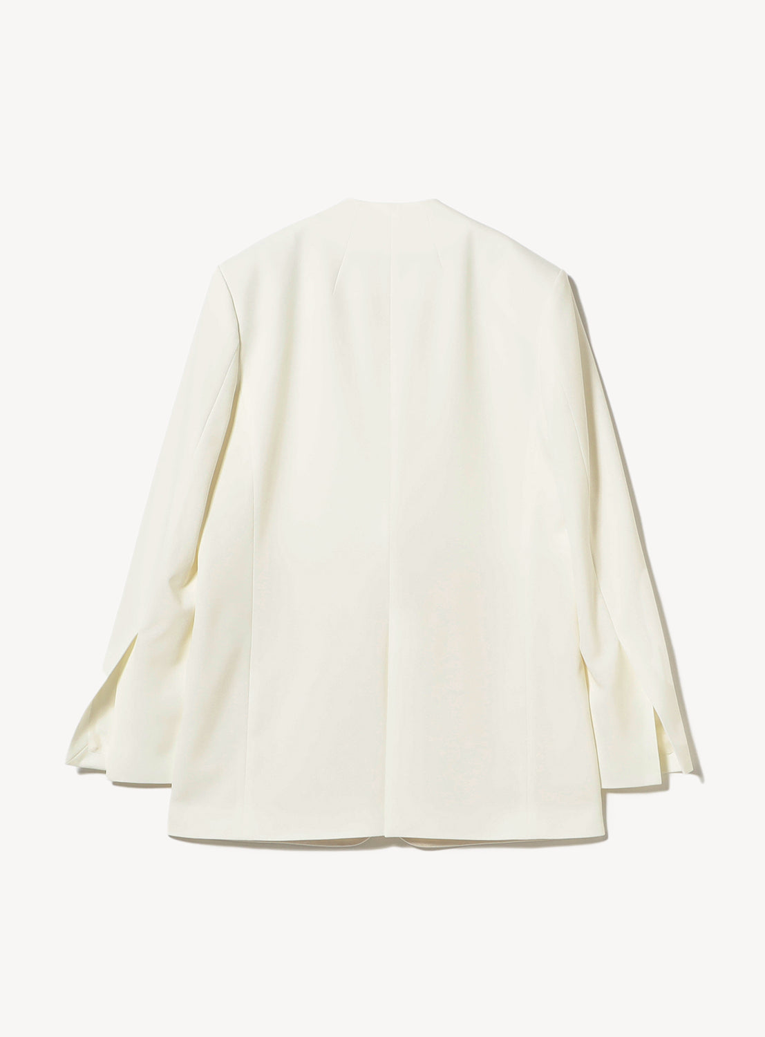 Back view of a minimalist white blazer with a clean, collarless design and subtle tailoring seams, laid flat on a white background.