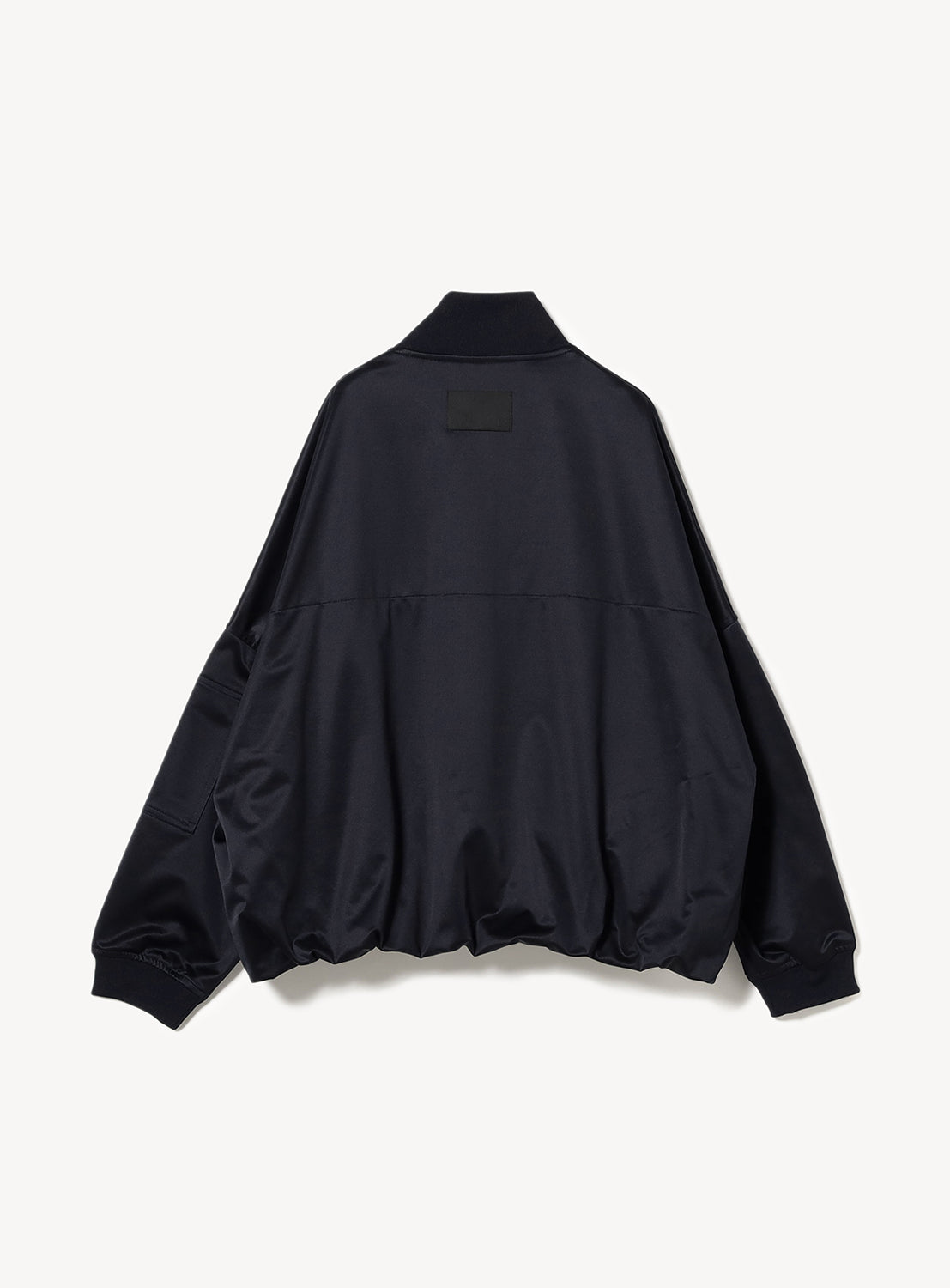 Back of a navy MA-1 jacket, showcasing its dynamic and sculptural silhouette.