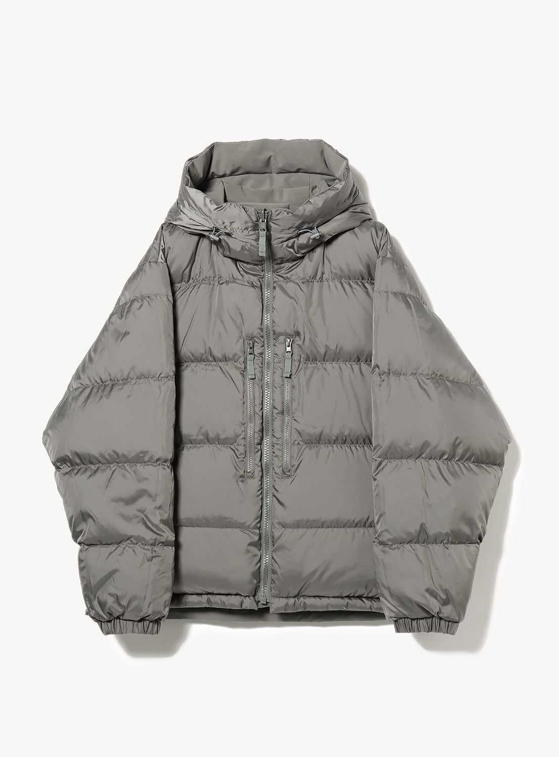 Other side of the gray hooded reversible jacket with a zipper and two front pockets.