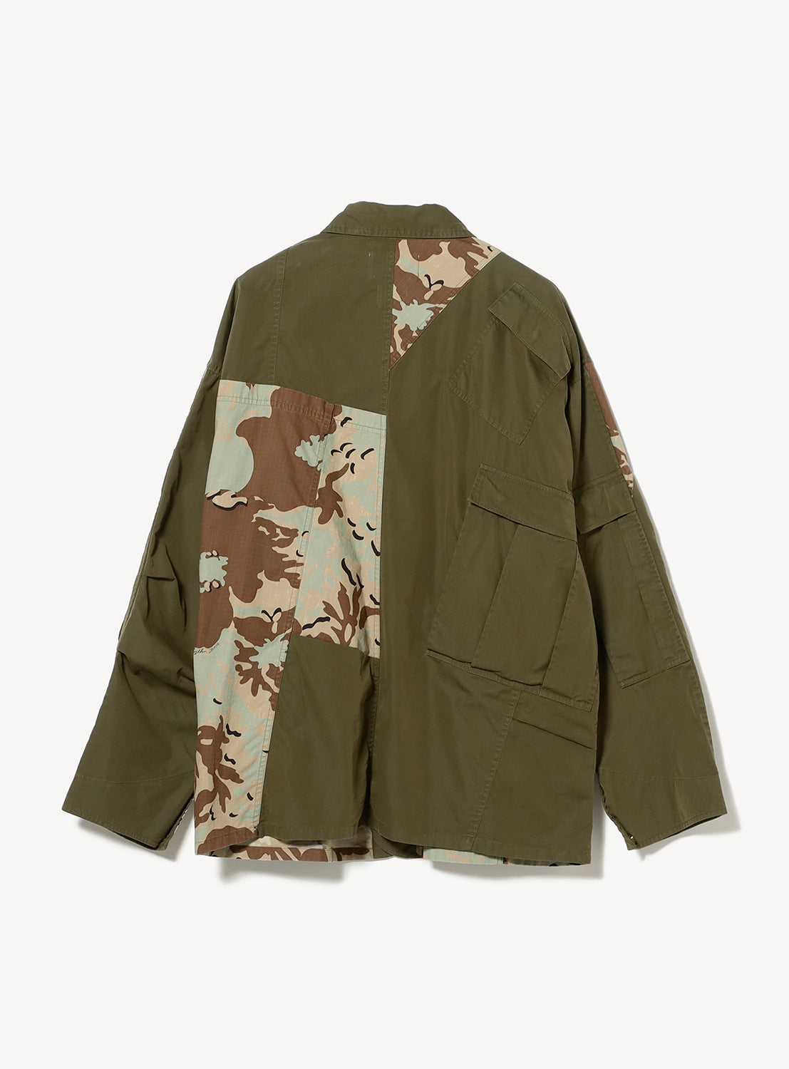 The NOMARHYTHM TEXTILE x Needles Rebuild Coverall Jacket by NOMARHYTHM TEXTILE features an olive green loose-fit silhouette, highlighted with oversized patchwork sections in brown, tan, and green camouflage patterns along the back and one sleeve, bringing a modern utilitarian workwear aesthetic.