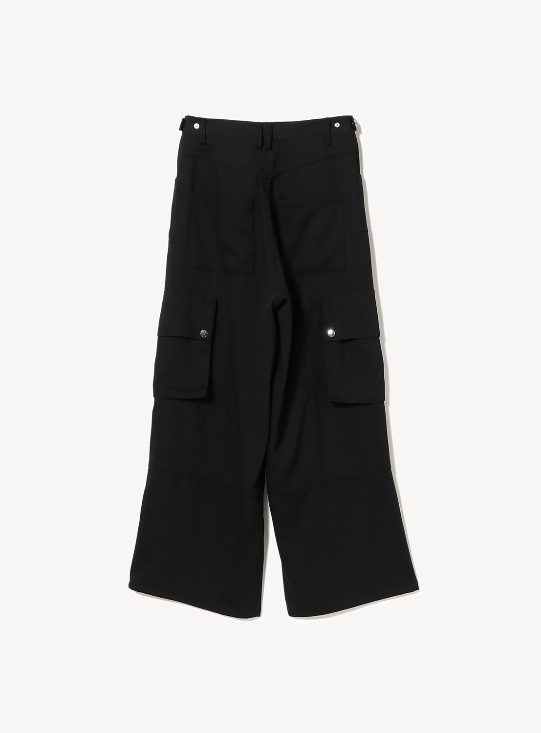 Full view from above of black wide-leg cargo pants, highlighting the baggy silhouette and utilitarian pockets.