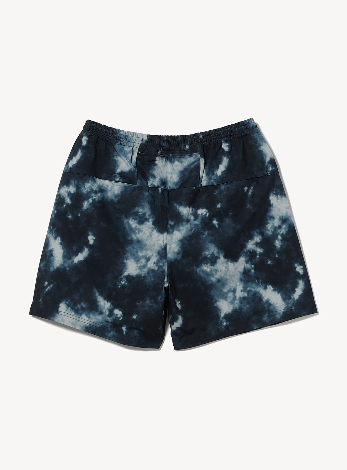 The BEAMS Dynamic Dry Wide Fit Shorts, featuring a navy blue and white tie-dye pattern, are crafted from quick-drying lightweight performance fabric and designed with an elastic waistband; shown laid flat on a white background.