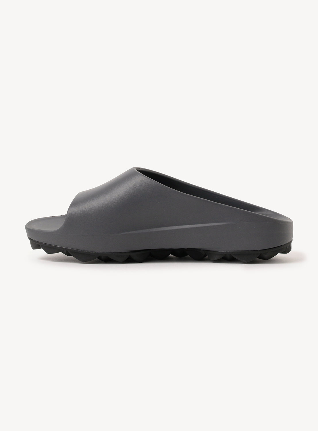 Single dark grey slide, highlighting the chunky sole and open-toe design.