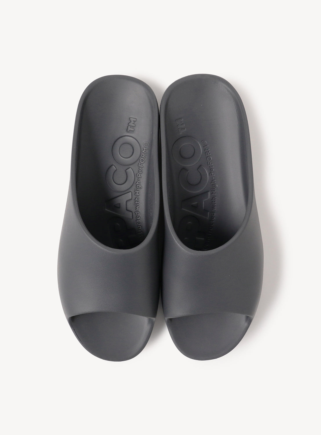 Birds-eye view of the grey slip-on sandals, with a focus on the toe strap and logo detail.