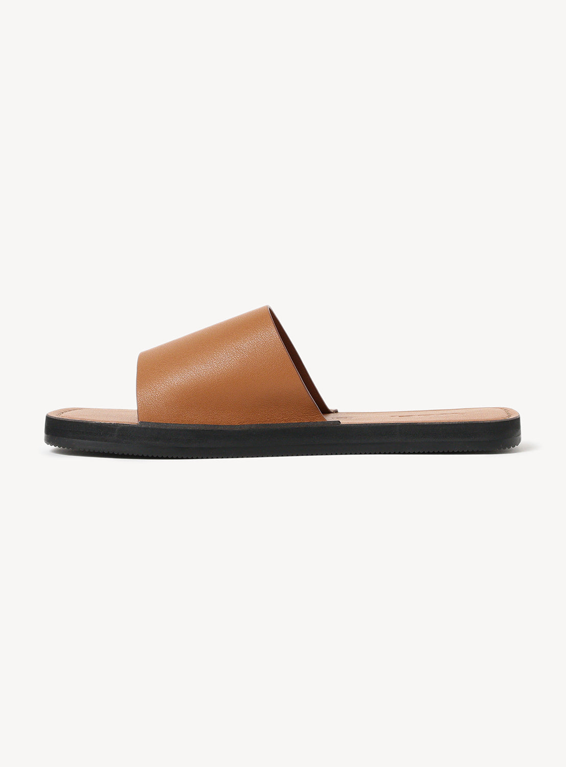 Brown leather sandal with black sole.