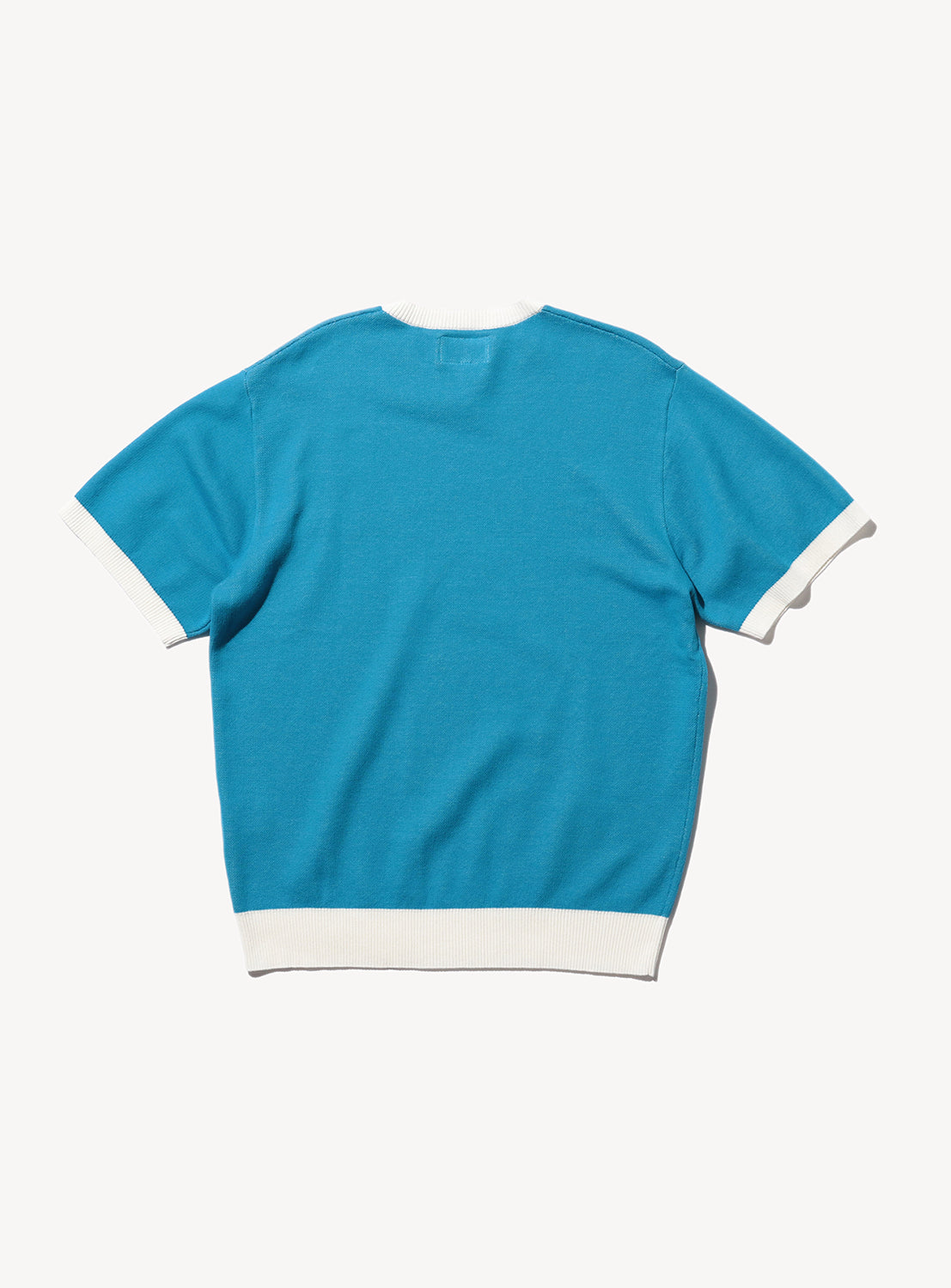 Plain back of knitted shirt.