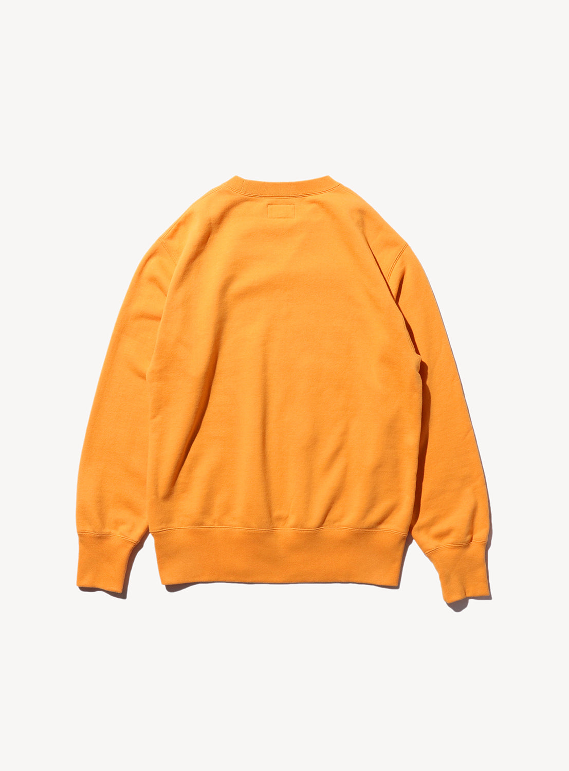 Plain back of orange sweatshirt.