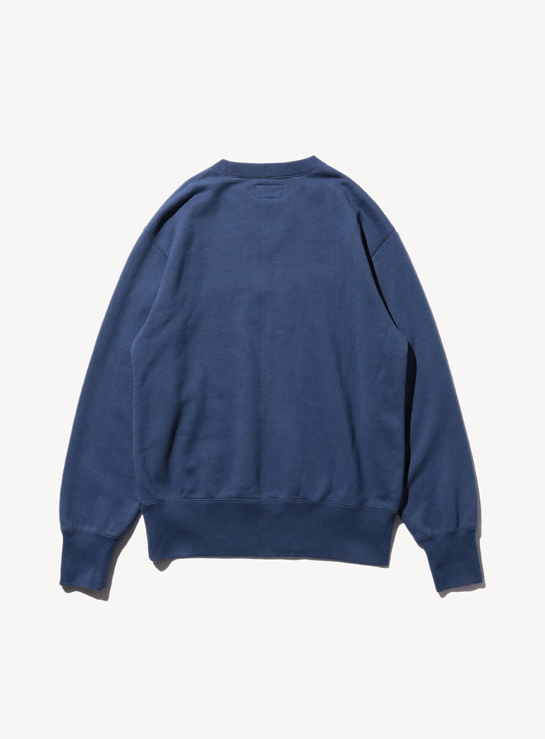 Plain back of a navy blue sweatshirt.