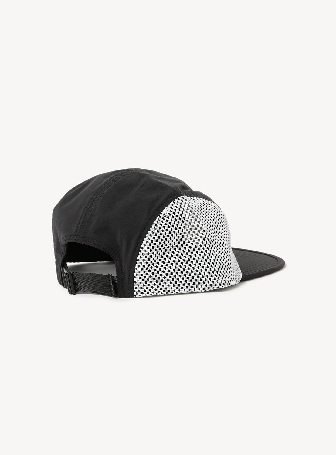 Black cap and white mesh side with an adjustable strap.