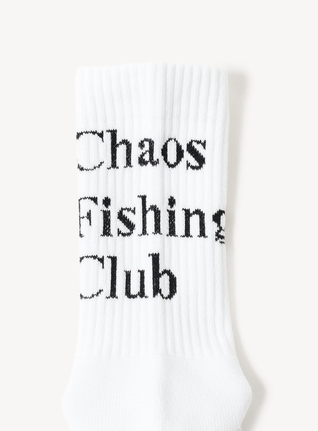 White sock with 'Chaos Fishing Club' text in black.
