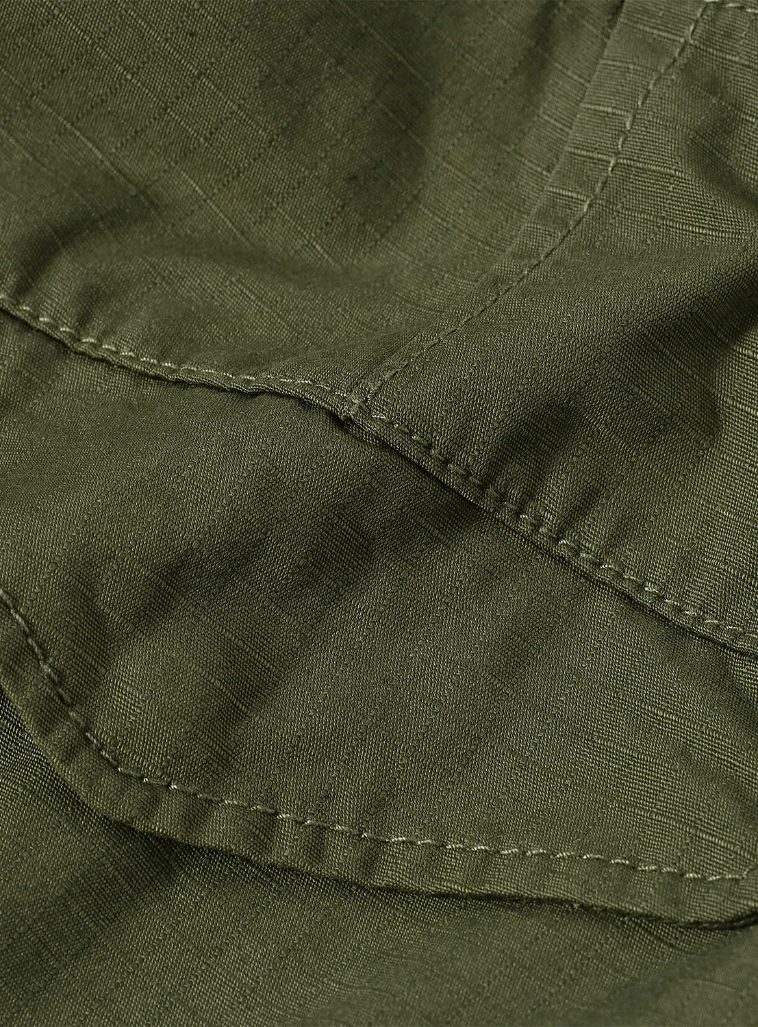 Close-up of the shorts' cargo pocket, highlighting the rugged aesthetic and functional design.