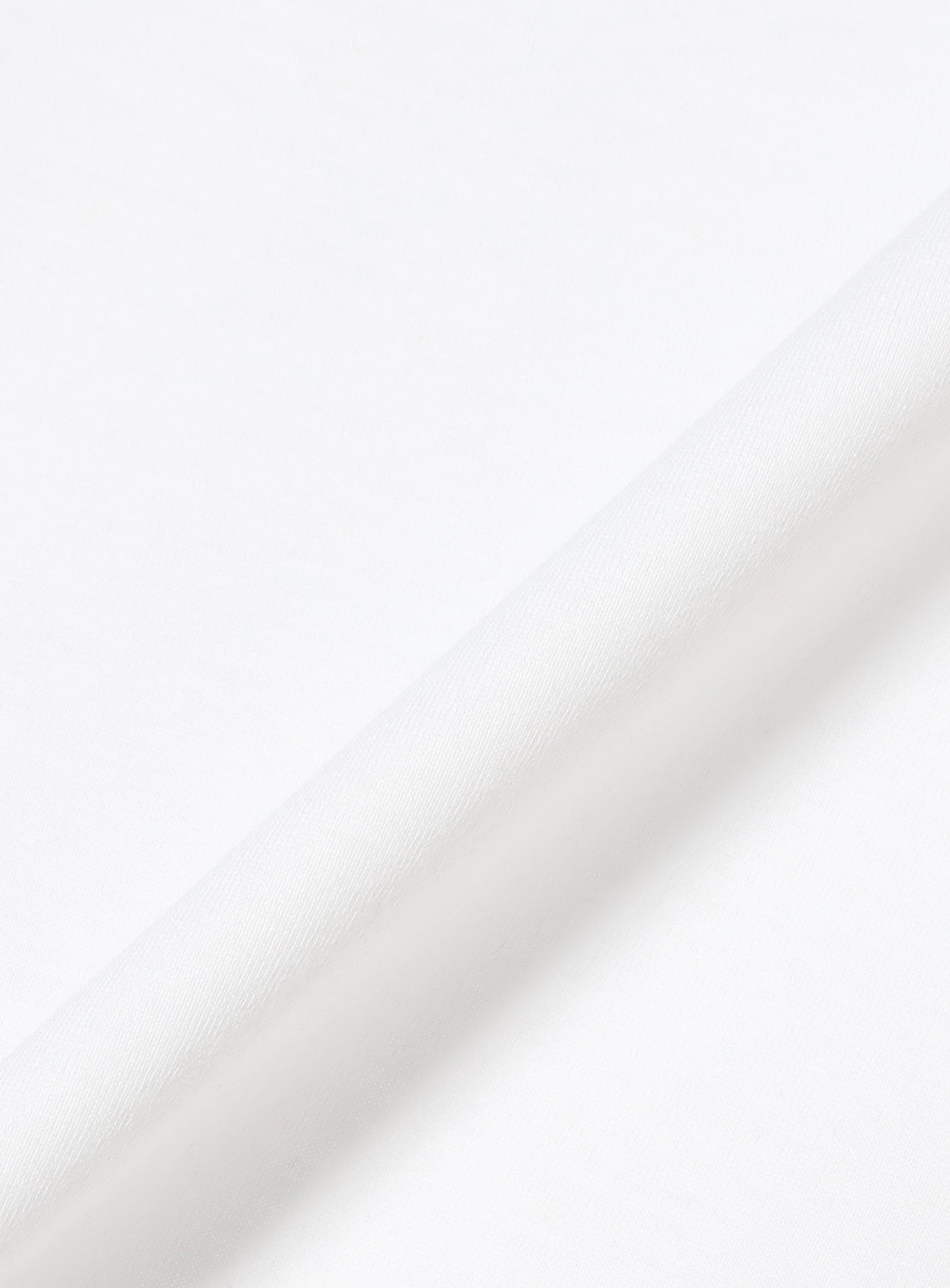 Close-up of the white cotton material.