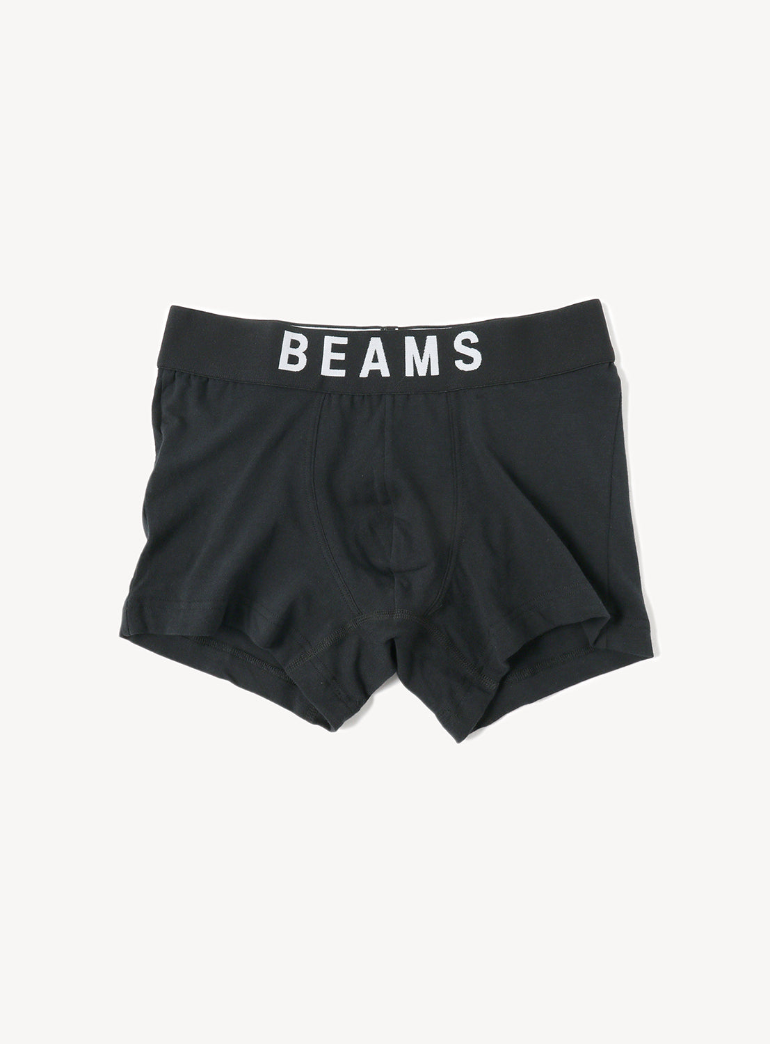 Basic black boxer shorts, featuring s a wide elastic waistband prominently adorned with the brand name "BEAMS" in bold white letters.