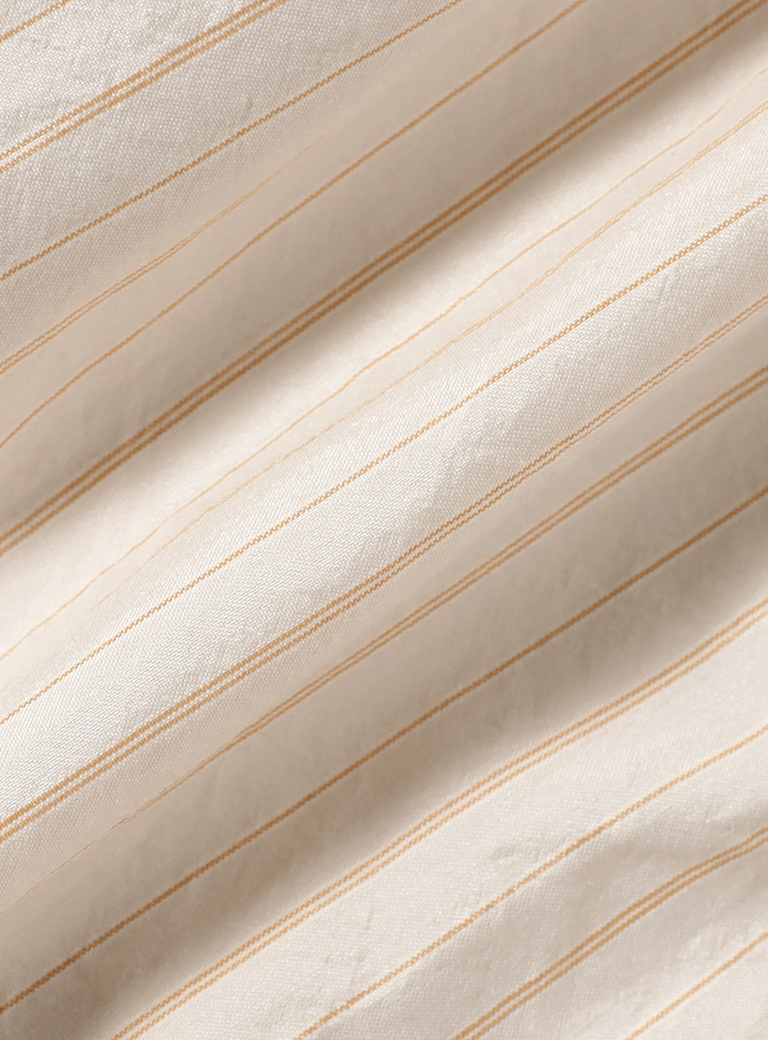 Close up of the ivory striped shorts.