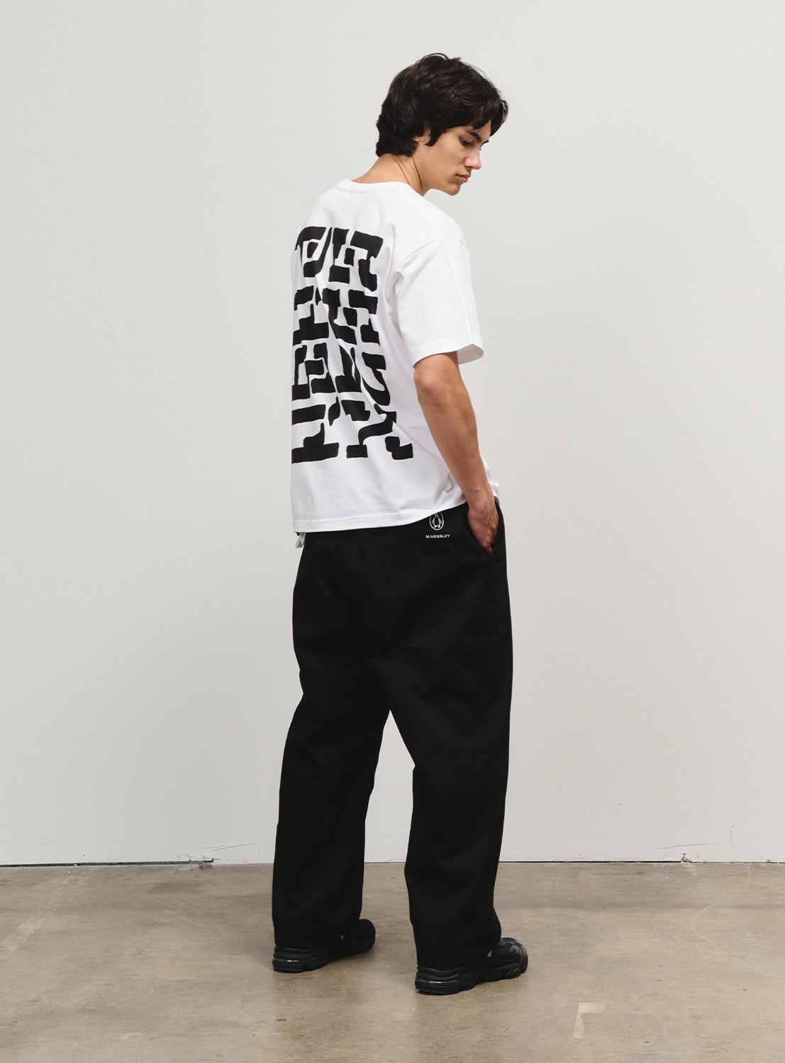 Back view of a model in the black pants from the Flying Elephant collection, celebrating a 1990s skate icon.