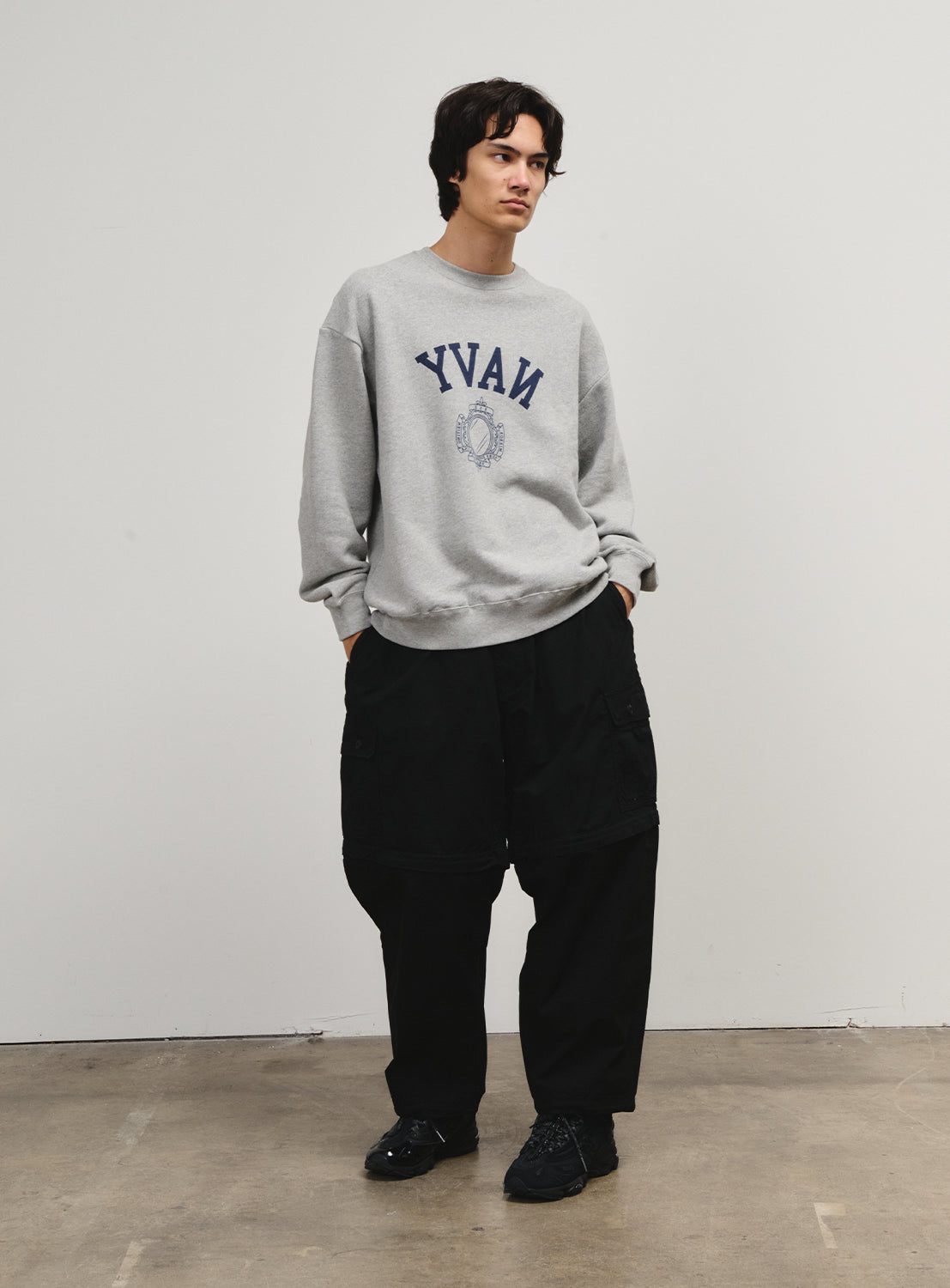 Model in black pants from the Flying Elephant collection, blending '90s skate spirit with a contemporary edge.