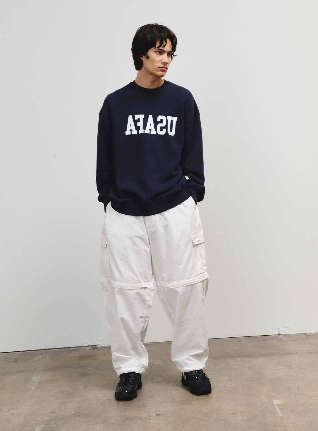 Model wearing the piece as white pants, styled to reflect the 1990s skate legacy of Matt Hensley.