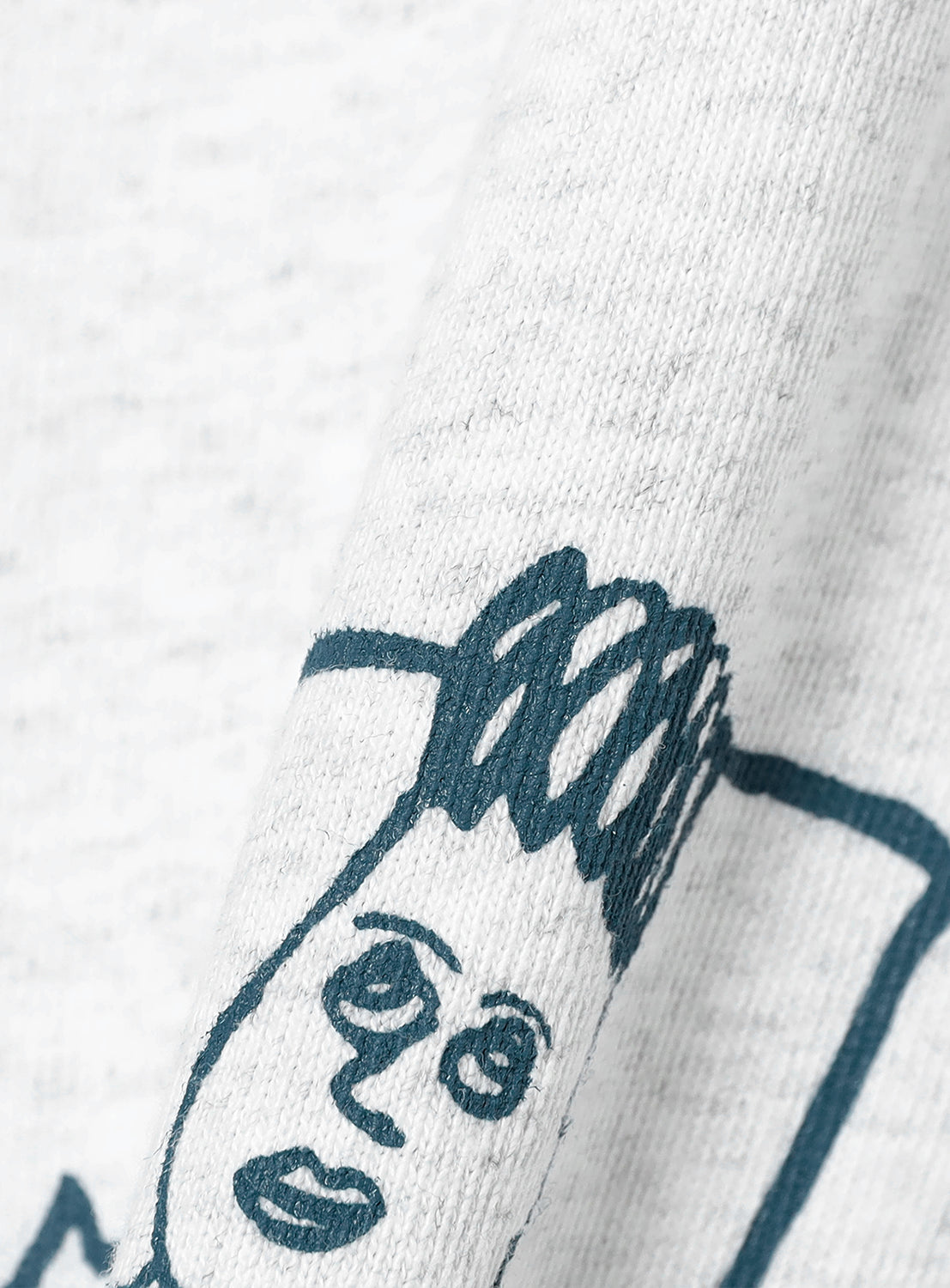 Close up of the ash grey t-shirt with a close up of the printed graphic.