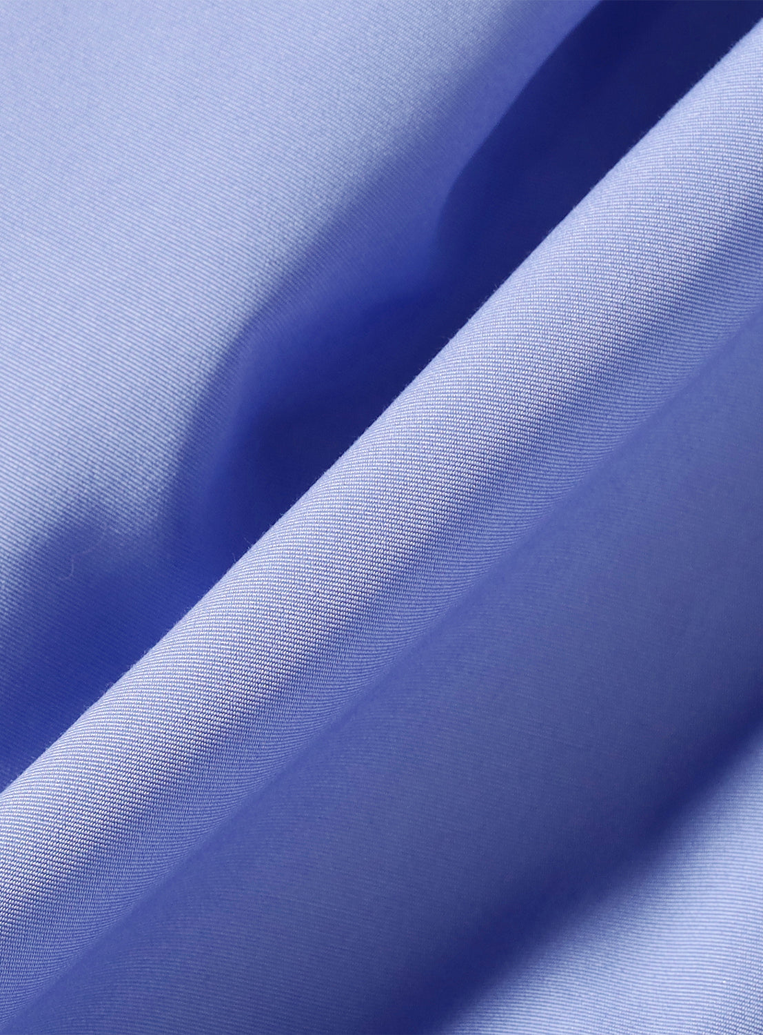 Close-up of the light blue material, highlighting the fabric's soft drape and weave.