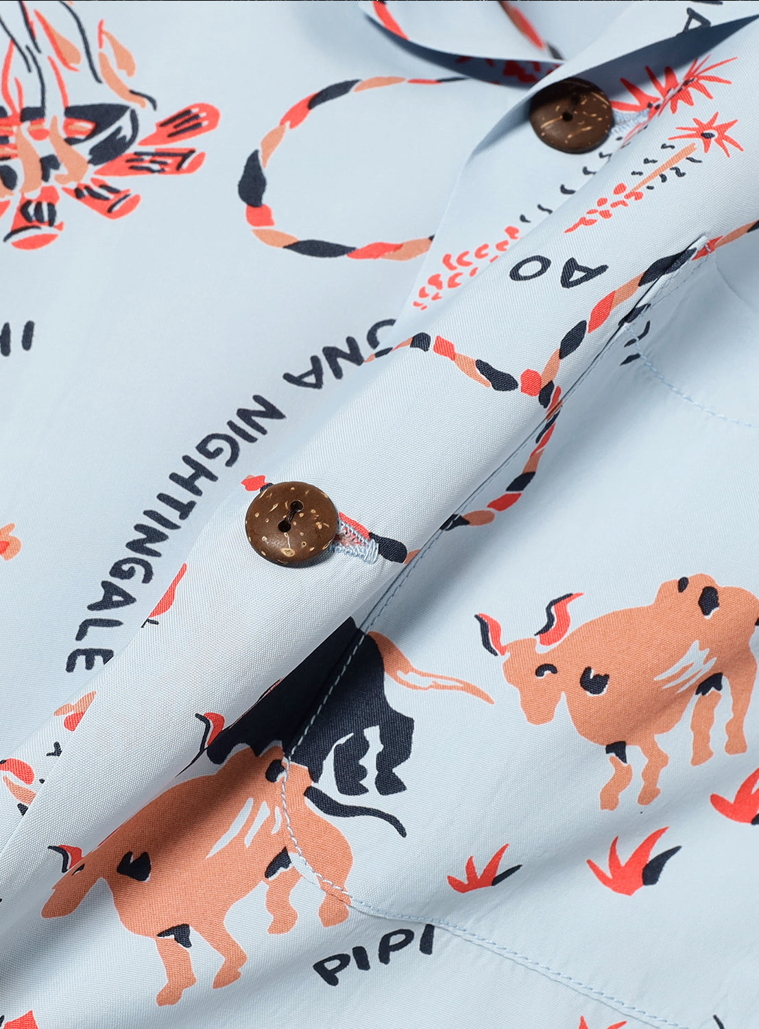 Close-up of the printed material, highlighting the fabric's quality and unique design, including a button.