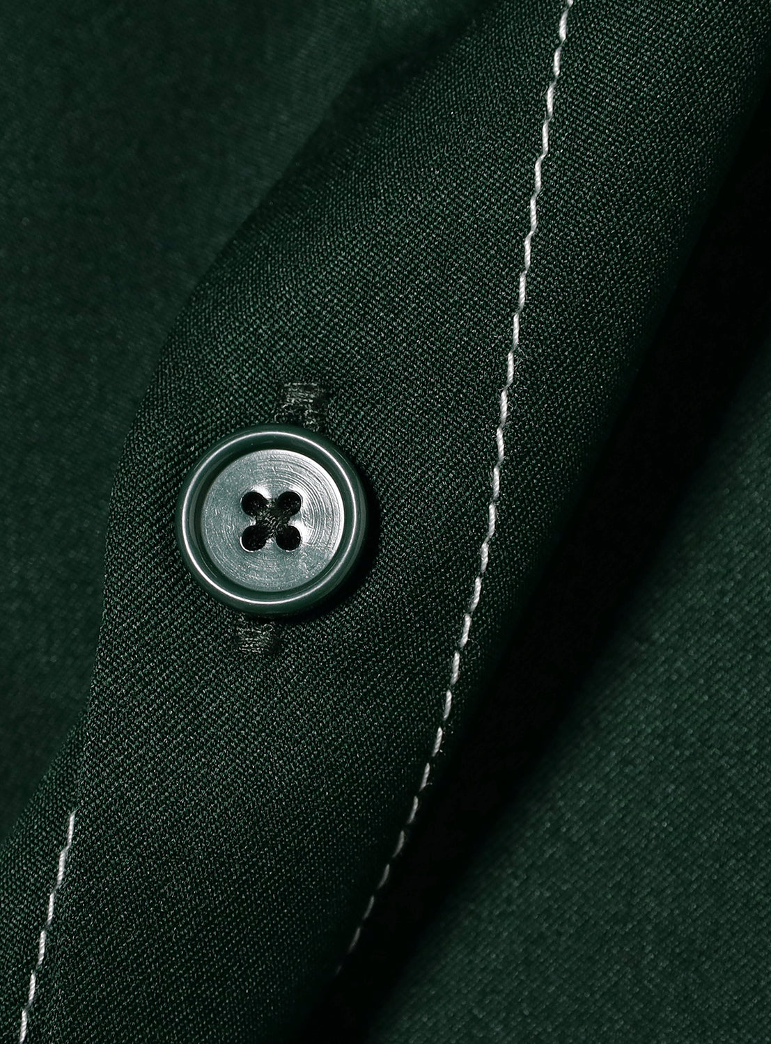 Close-up of dark green BEAMS Stitching Easy Shirt with matching button and white stitching, made from quick-drying polyester fabric.