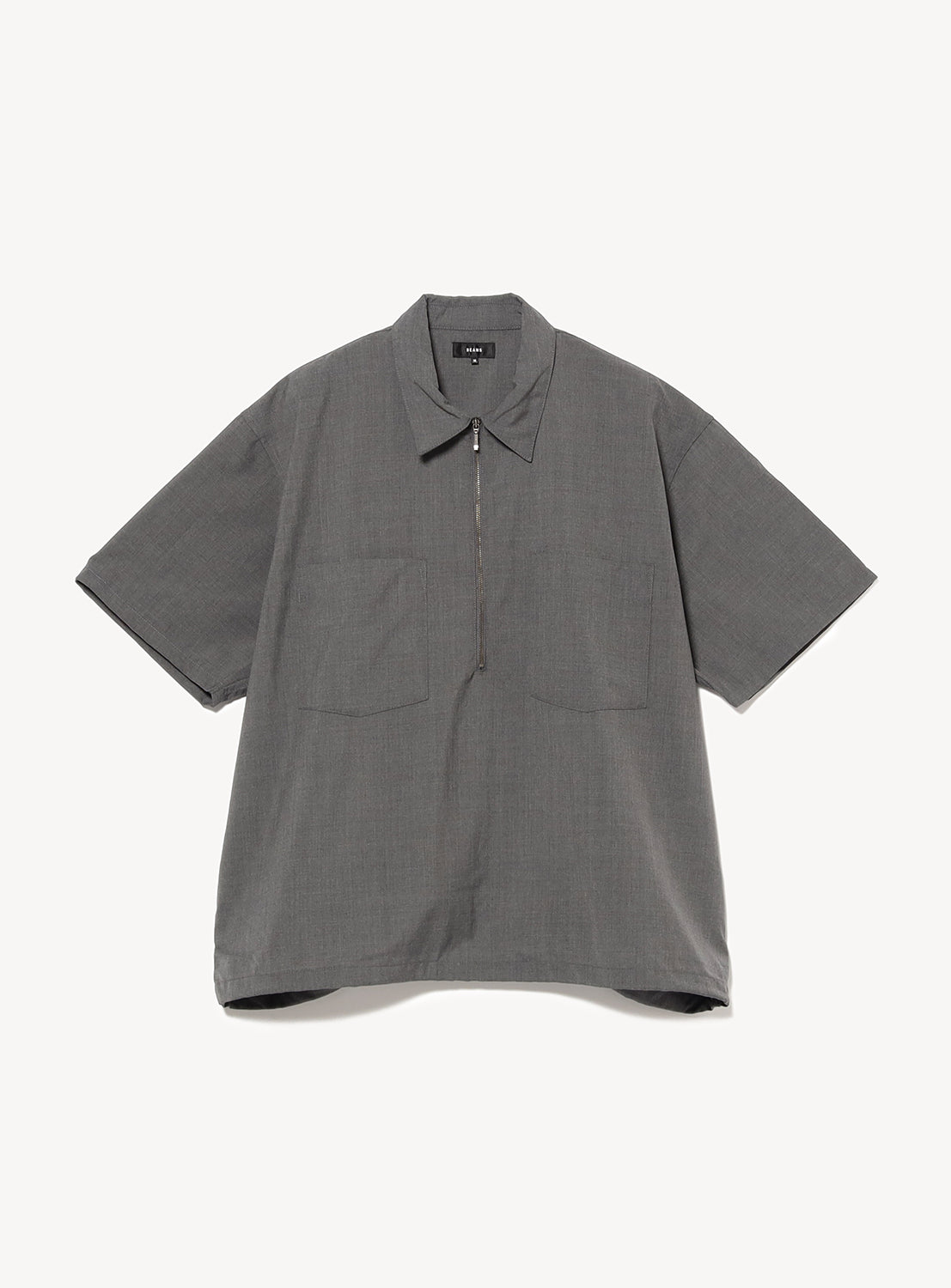 Grey short-sleeve pullover shirt with pockets and a silver zipper.