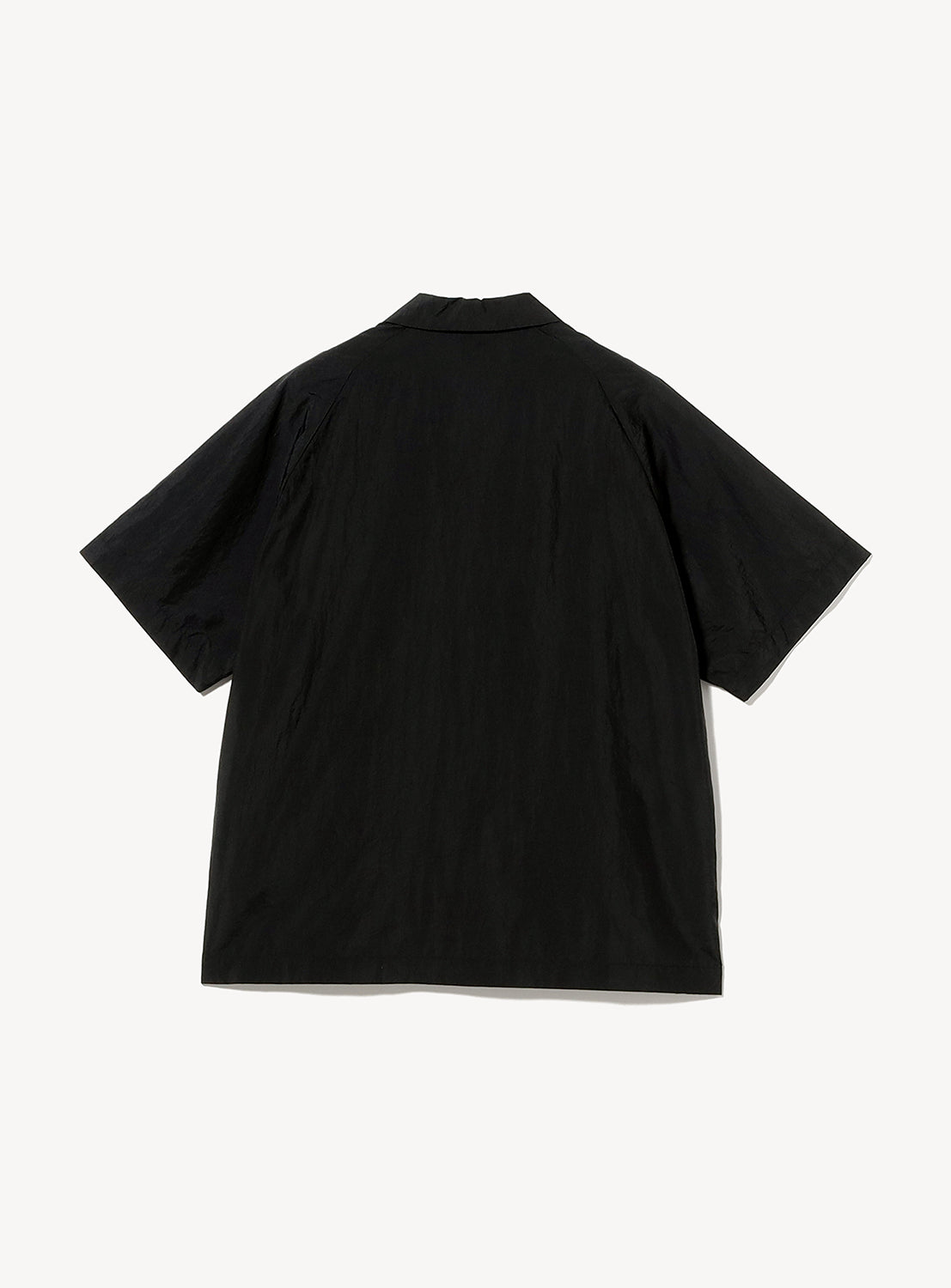 The TEATORA CAMBRIAN Short Sleeve Shirt - HOVER LAYER UNIT-01 by TEATORA, featuring a black color, short sleeves, and a collared lightweight performance design, is displayed laid flat with the back side facing up against a plain white background.