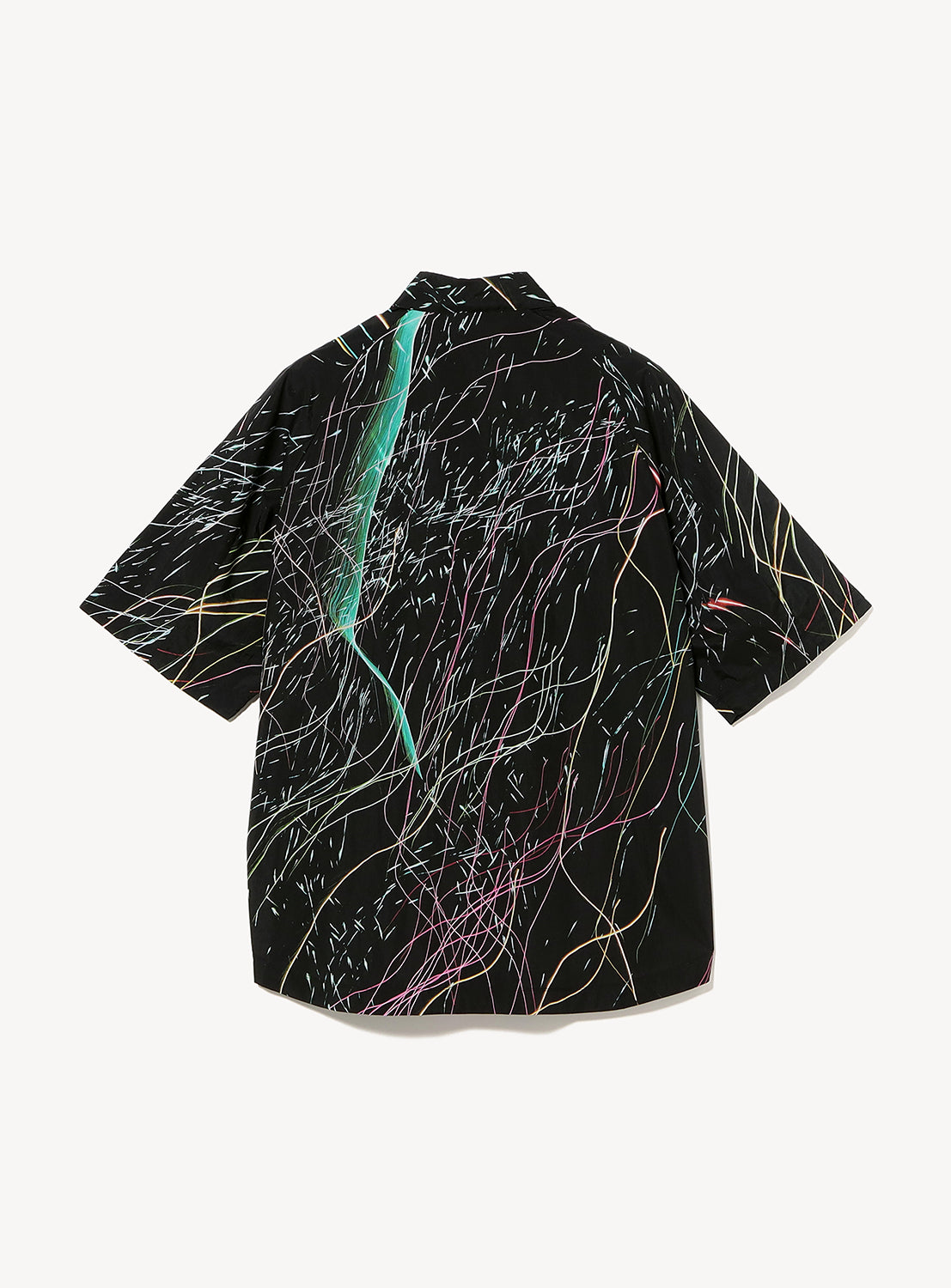Introducing the TEATORA Short Sleeve Cartridge Shirt—a black, ultra-lightweight shirt with a relaxed fit, showcasing a vibrant abstract pattern of slender wavy lines in green, pink, yellow, and white across the fabric. Wrinkle-resistant and designed for effortless travel, this shirt combines striking style with maximum convenience.