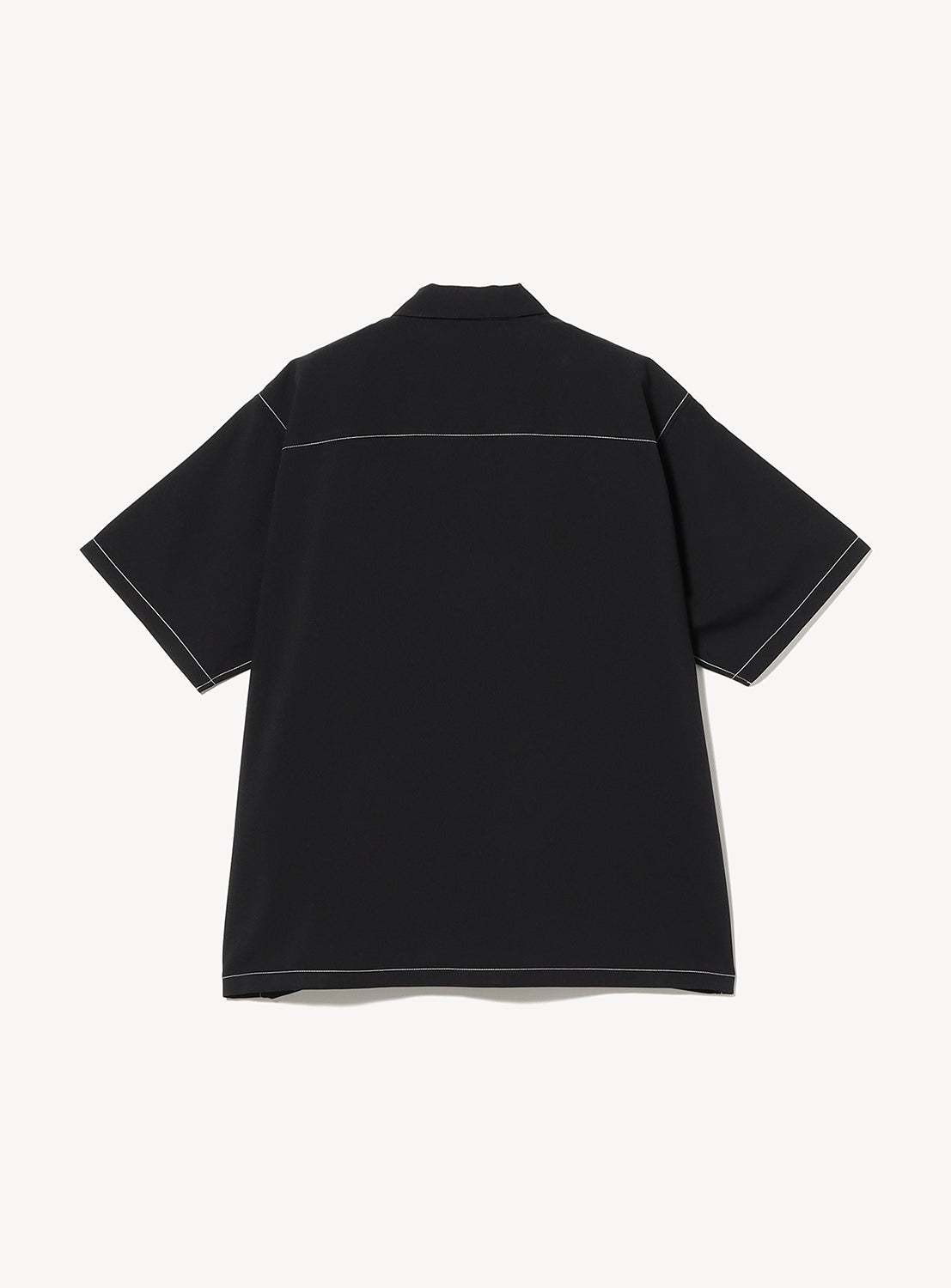 Back view of the BEAMS Wide Fit Double Pocket Contrast Stitch Shirt in black, featuring white contrast stitching along the seams, sleeves, and upper back. Crafted from performance fabric, the short-sleeve shirt is displayed flat on a plain white background.