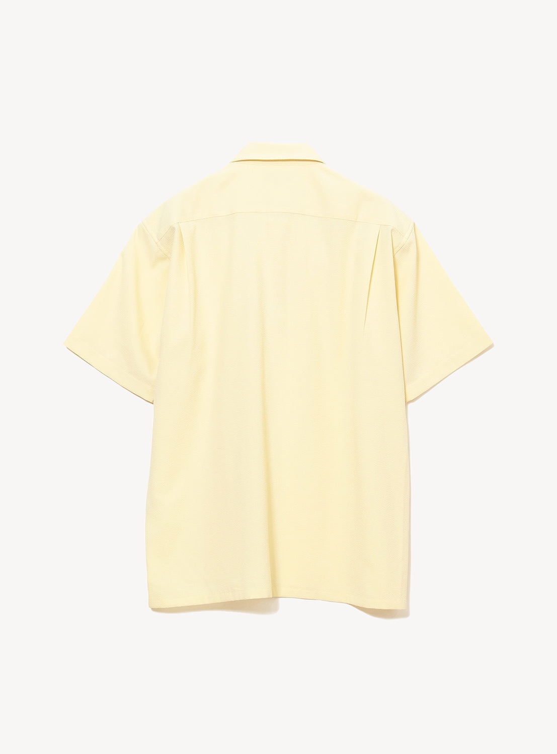The BEAMS Stretch Quick-Dry Seersucker Relaxed Fit Shirt is shown from the back in light yellow with short sleeves, displayed on a plain white background to emphasize its lightweight, breathable design.