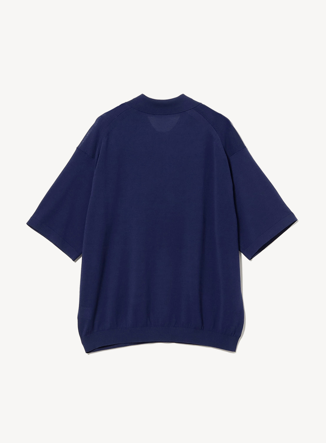 A crepuscule Short Sleeve Polo in plain navy blue with a relaxed fit is shown from the back against a white background.