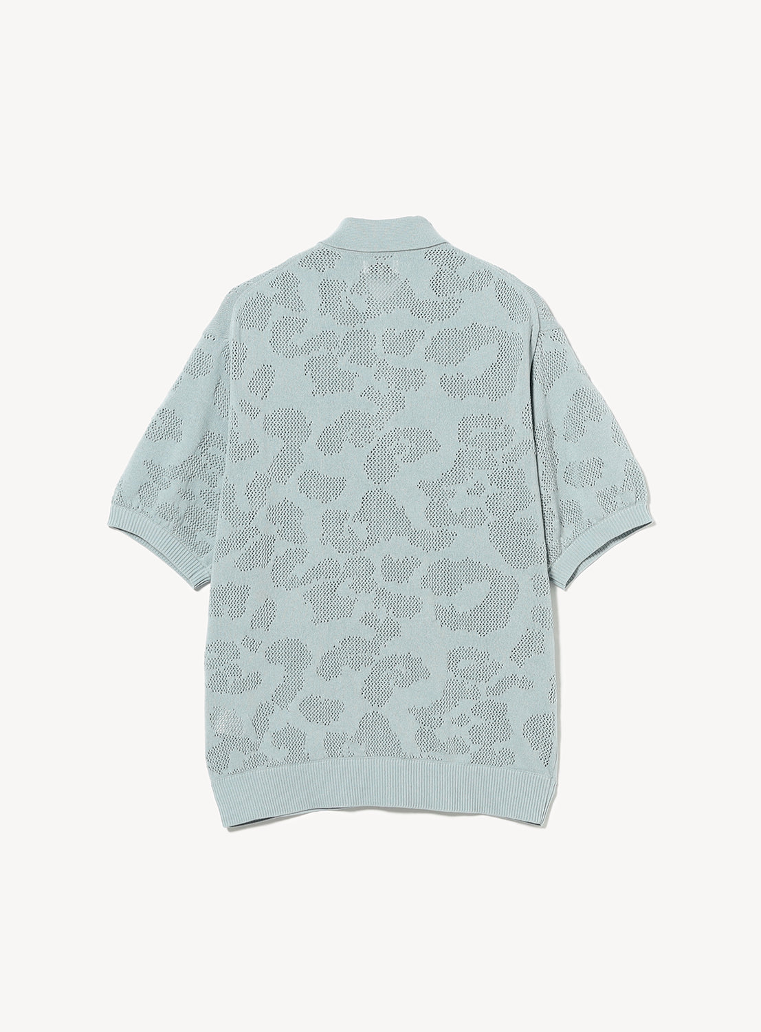 Light blue knit shirt with a subtle mesh pattern.