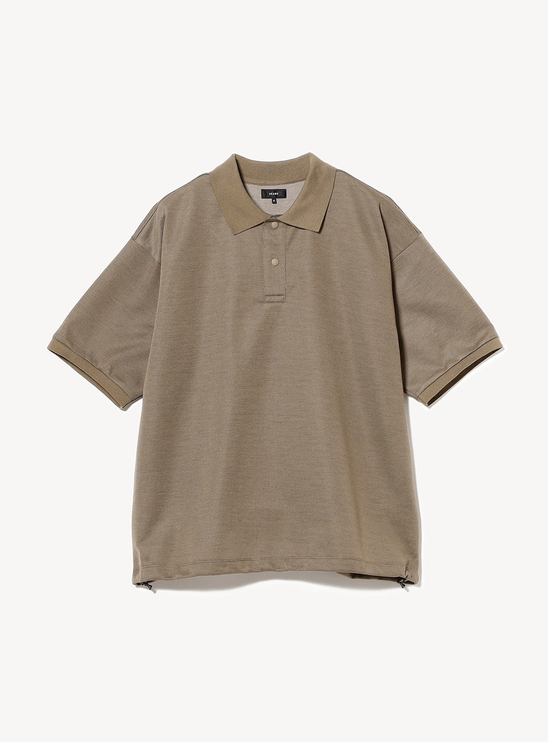 Taupe textured polo shirt flat lay, showcasing its oversized fit and classic collar.