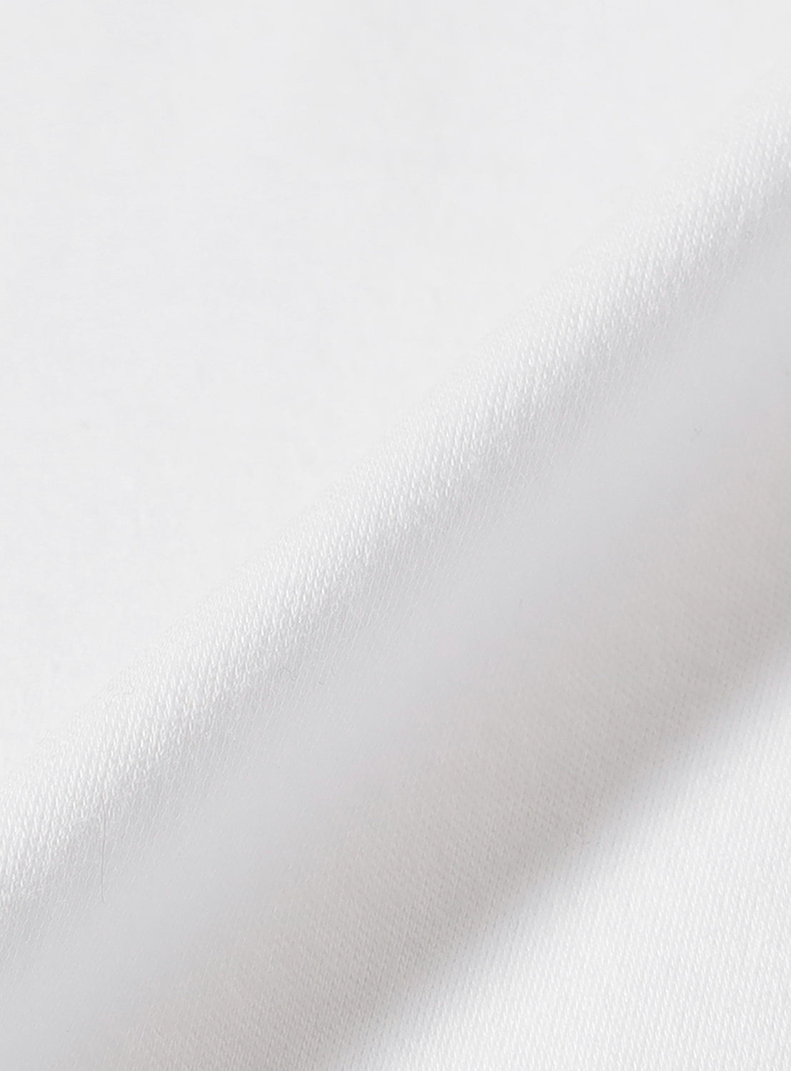 Close-up of the white material, highlighting the cotton quality.
