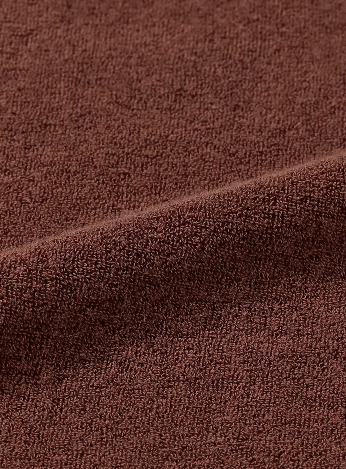 Close-up of brown textured fabric.