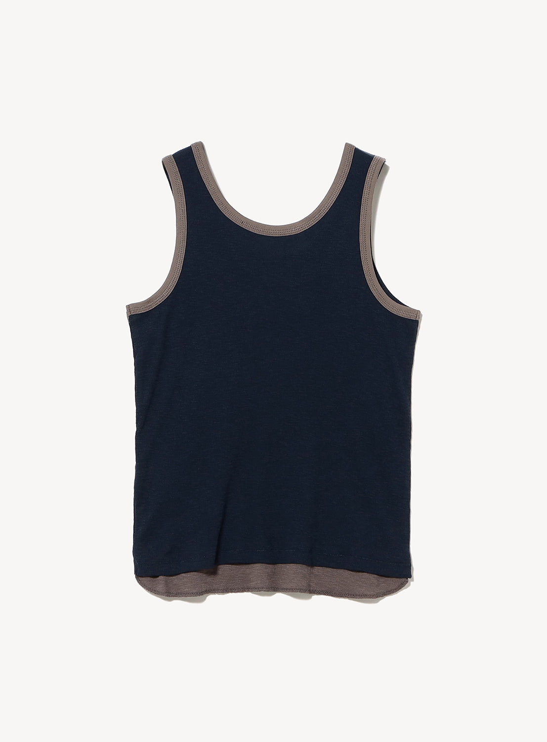 The Layered Rib Tank Top by BEAMS BOY is a sleeveless navy blue knit featuring ribbed texture and light brown trim along the neckline, armholes, and bottom hem, displayed flat against a white background.