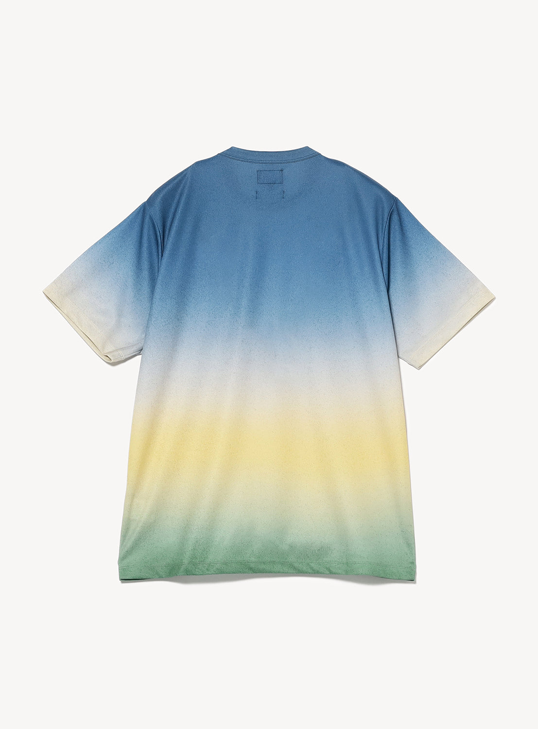 Full flat lay of a blue, yellow, and green gradient t-shirt, highlighting the ombre effect and relaxed fit.