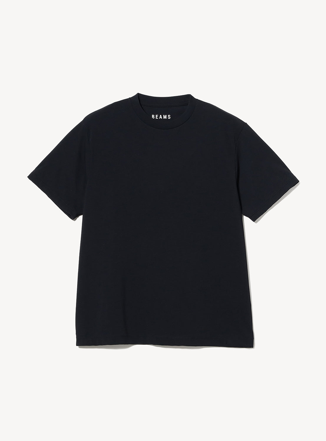 A plain black Relaxed Fit Heat Protection T-Shirt from BEAMS is laid flat on a white background. Crafted from premium Japanese fabric, this tee features a classic crew neckline and an inside label near the collar that reads BEAMS in white letters.