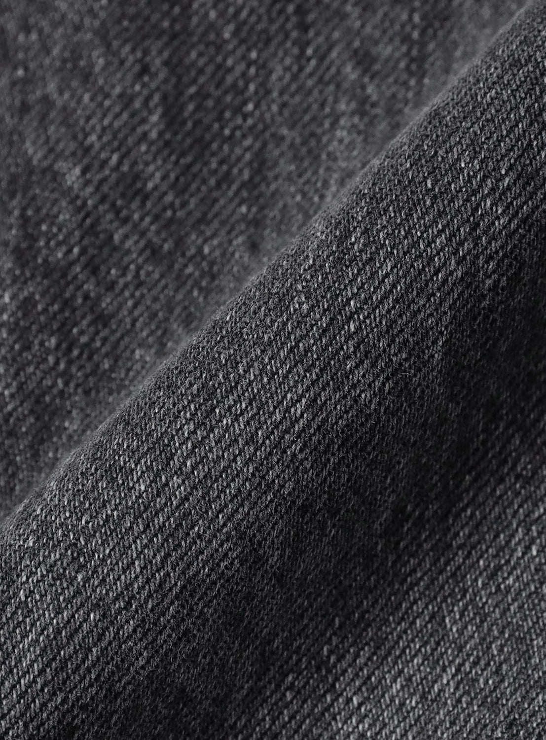 Close-up of dark gray denim fabric texture