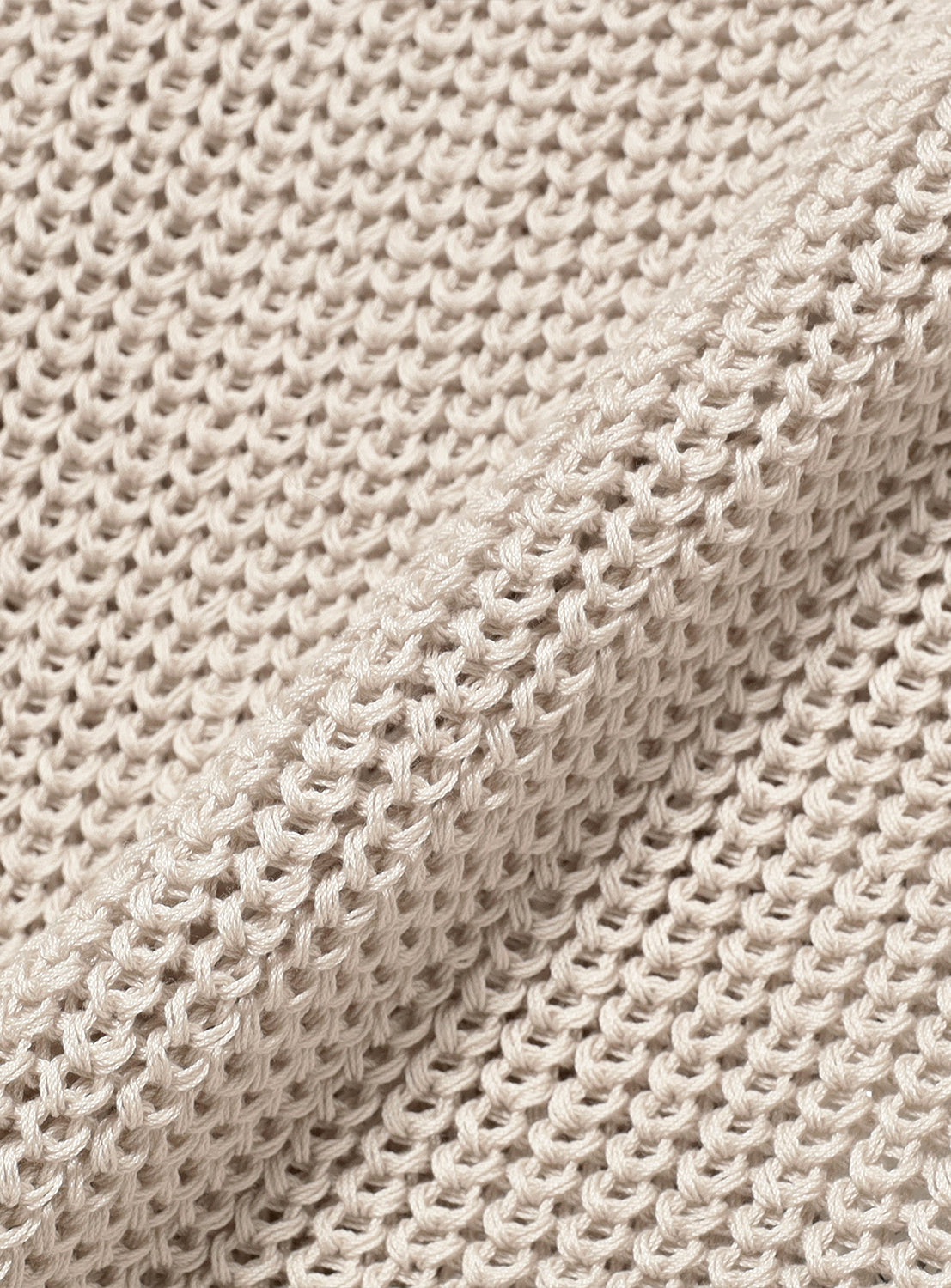 Close-up of the light grey material, highlighting the knit pattern.